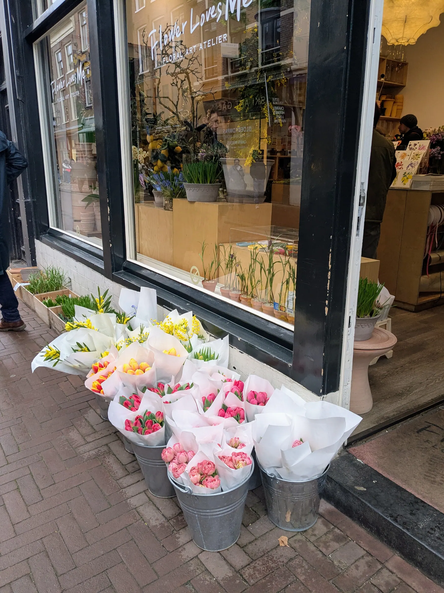 Buckets of tulips outside a flower shop in Amsterdam