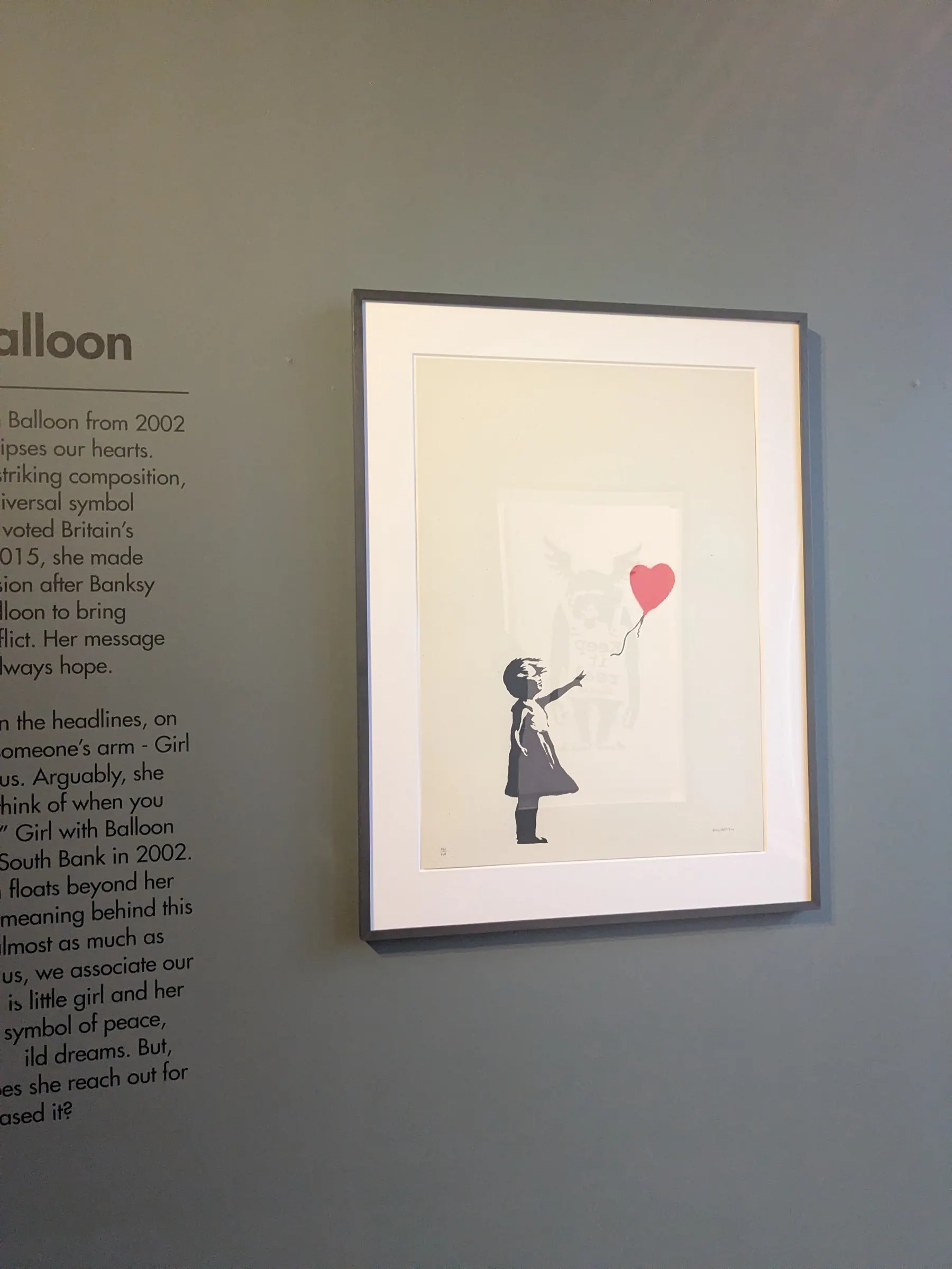 A Banksy balloon girl artwork at Moco Museum in Amsterdam