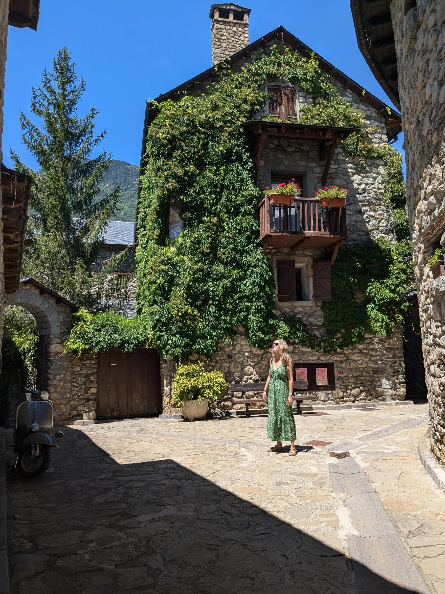 A traditional stone house and narrow lane in an Aragonese Pyrenees village