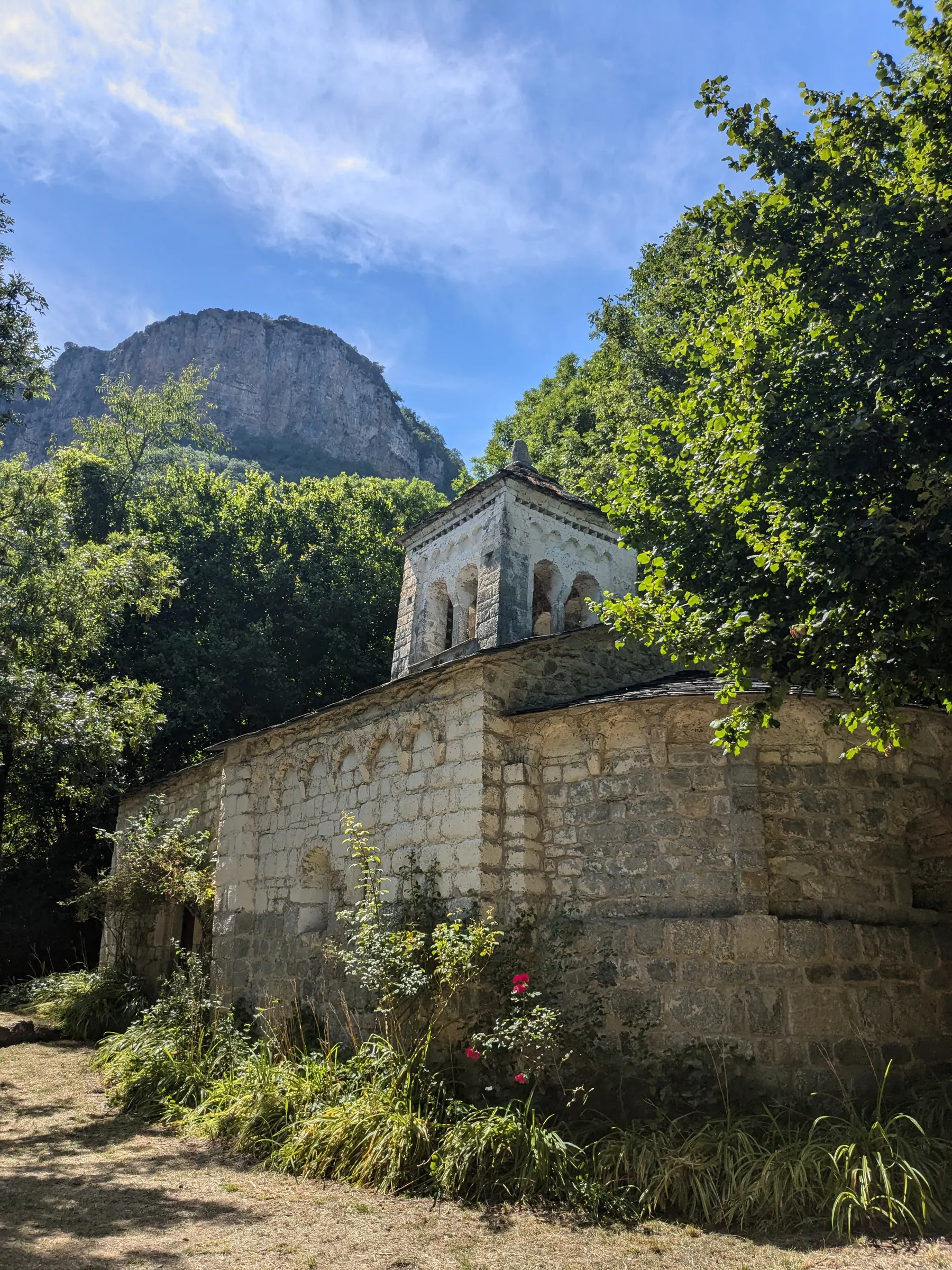 The Ermita de la Virgen de Gracia beneath a rocky mountain in the Aragonese Pyrenees