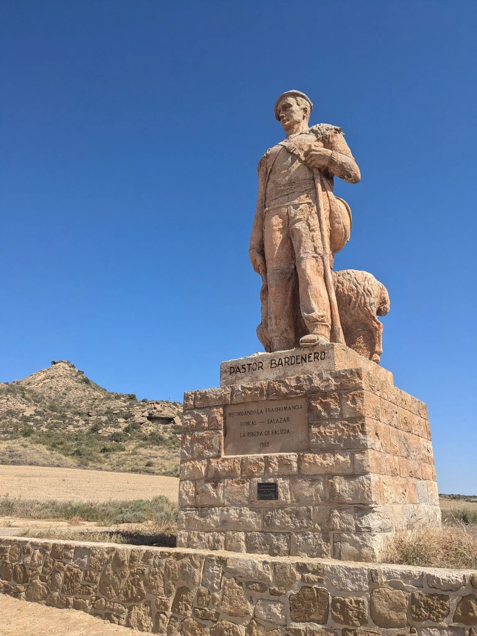 The Monument to the Shepherd statue in Bardenas Reales against a clear blue sky