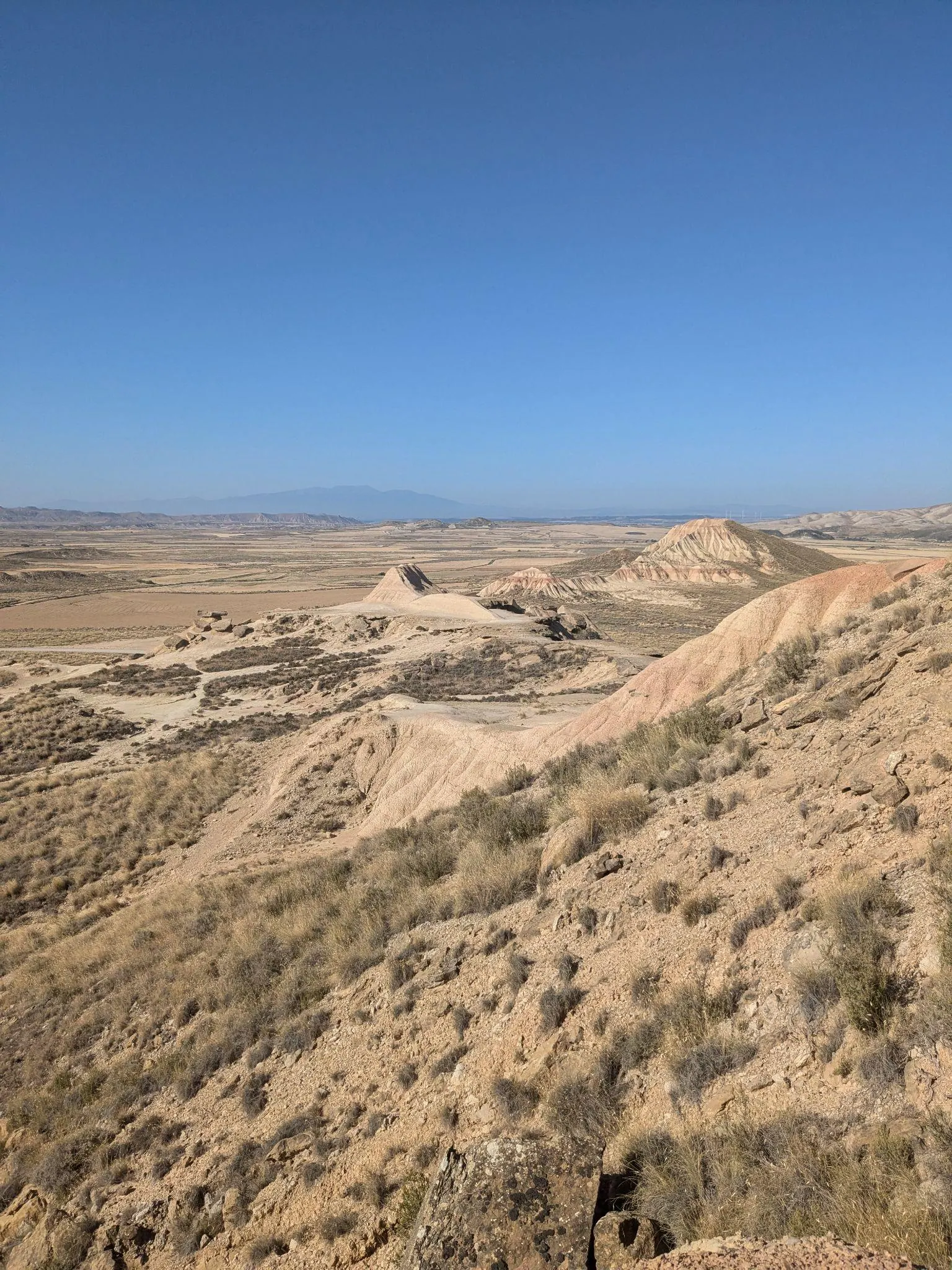 Wide dry valley and eroded hills in Bardenas Reales, Navarra