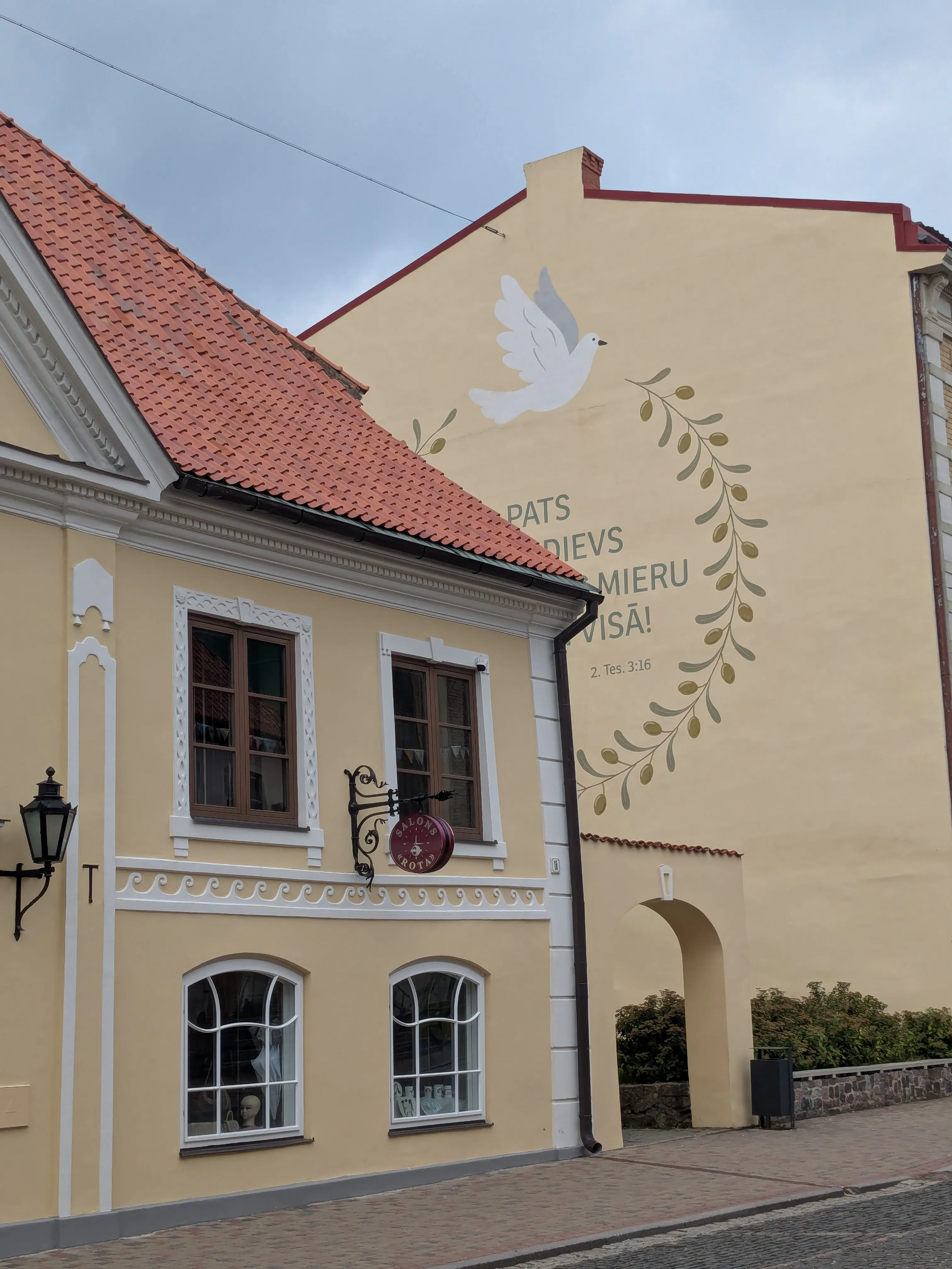 Historic yellow building on Rīgas iela in Cēsis