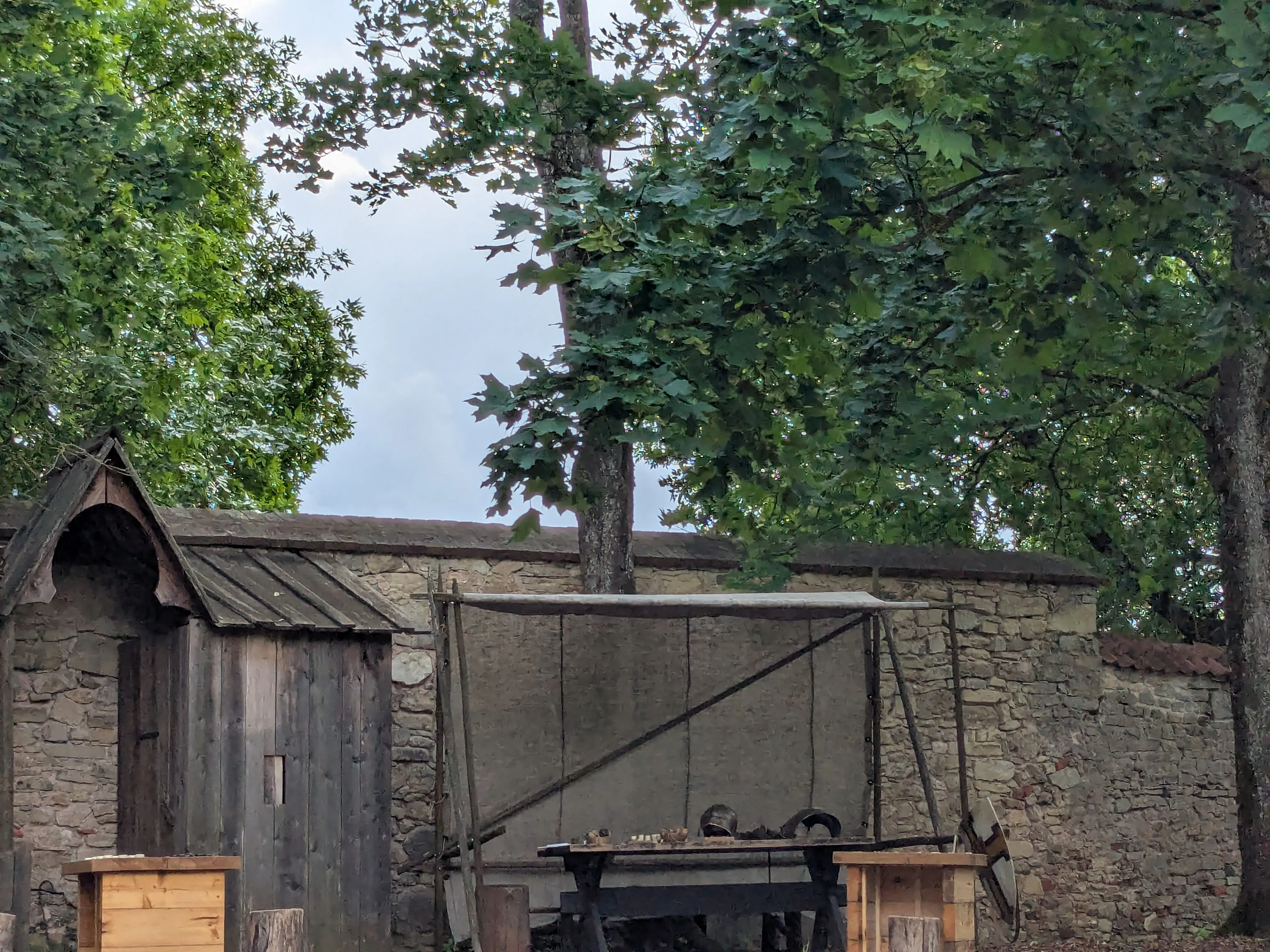 A timber structure against the medieval castle walls