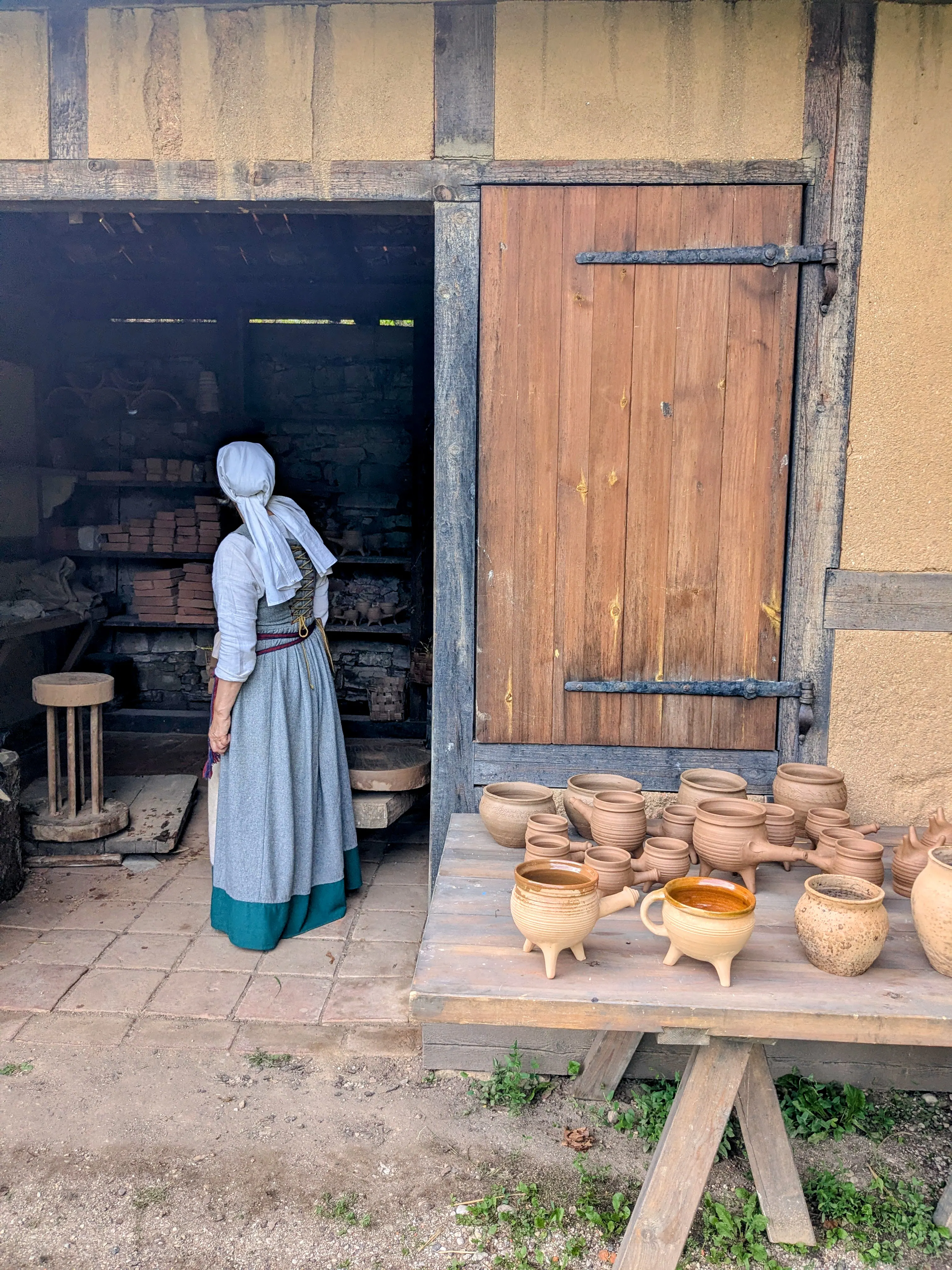 A costumed interpreter in the castle grounds