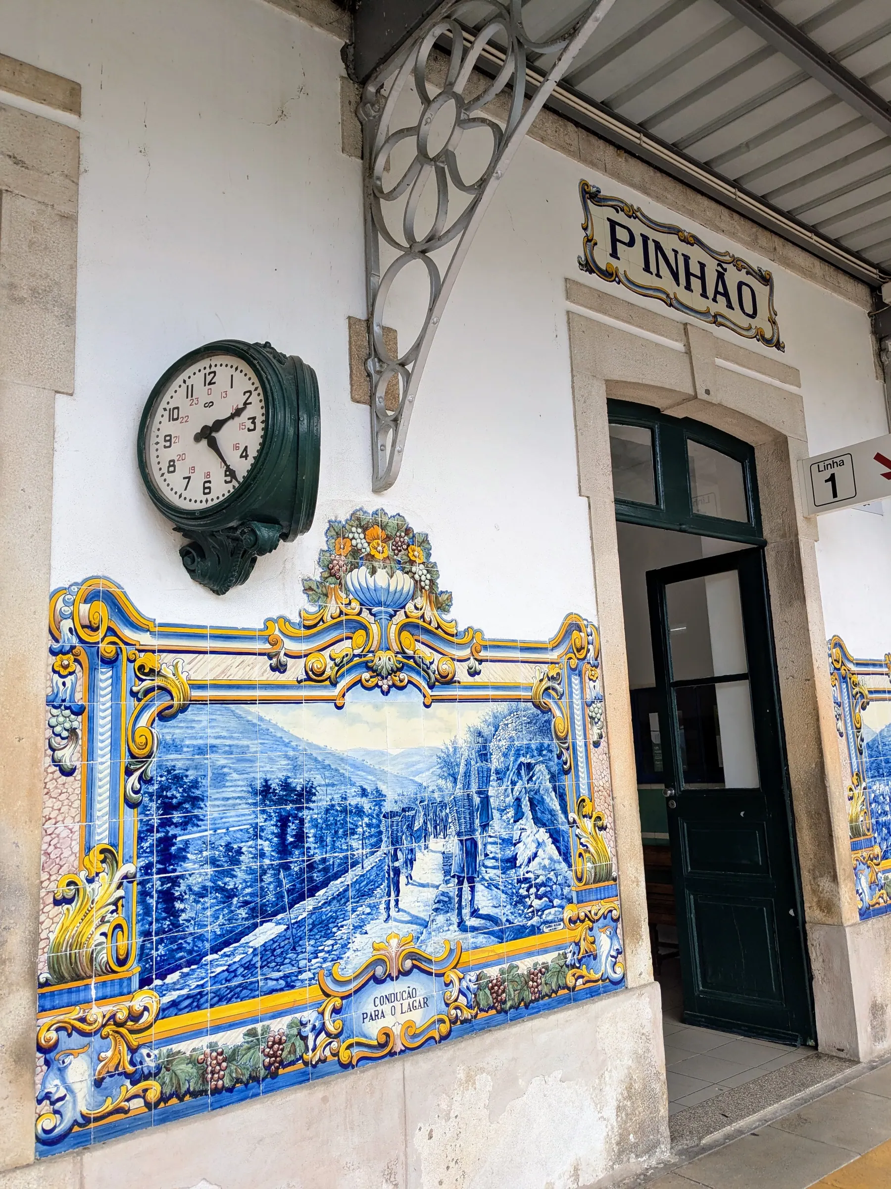 Azulejo tile panels and the station sign at Pinhão railway station