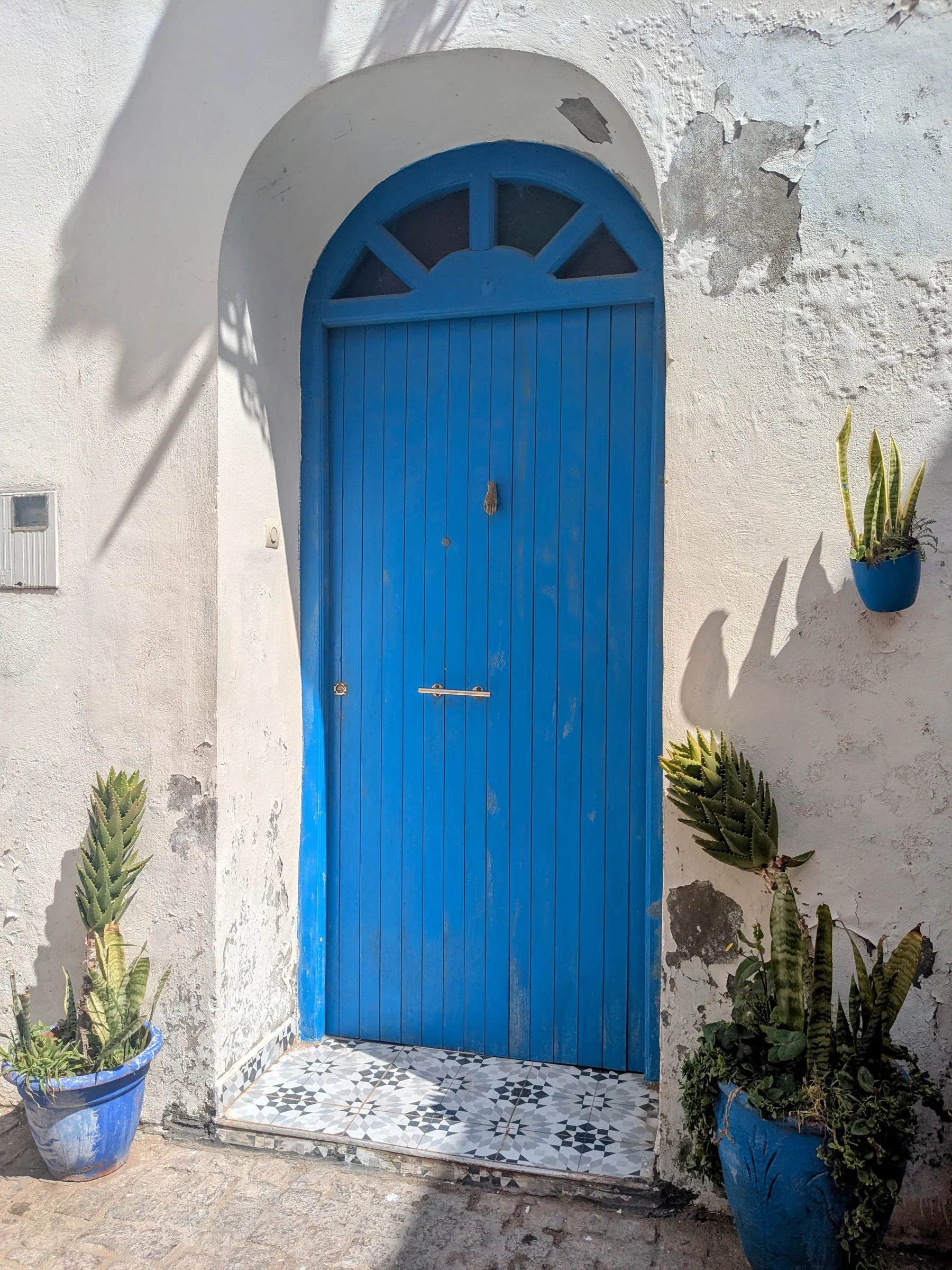 A bright blue arched door in the Essaouira medina