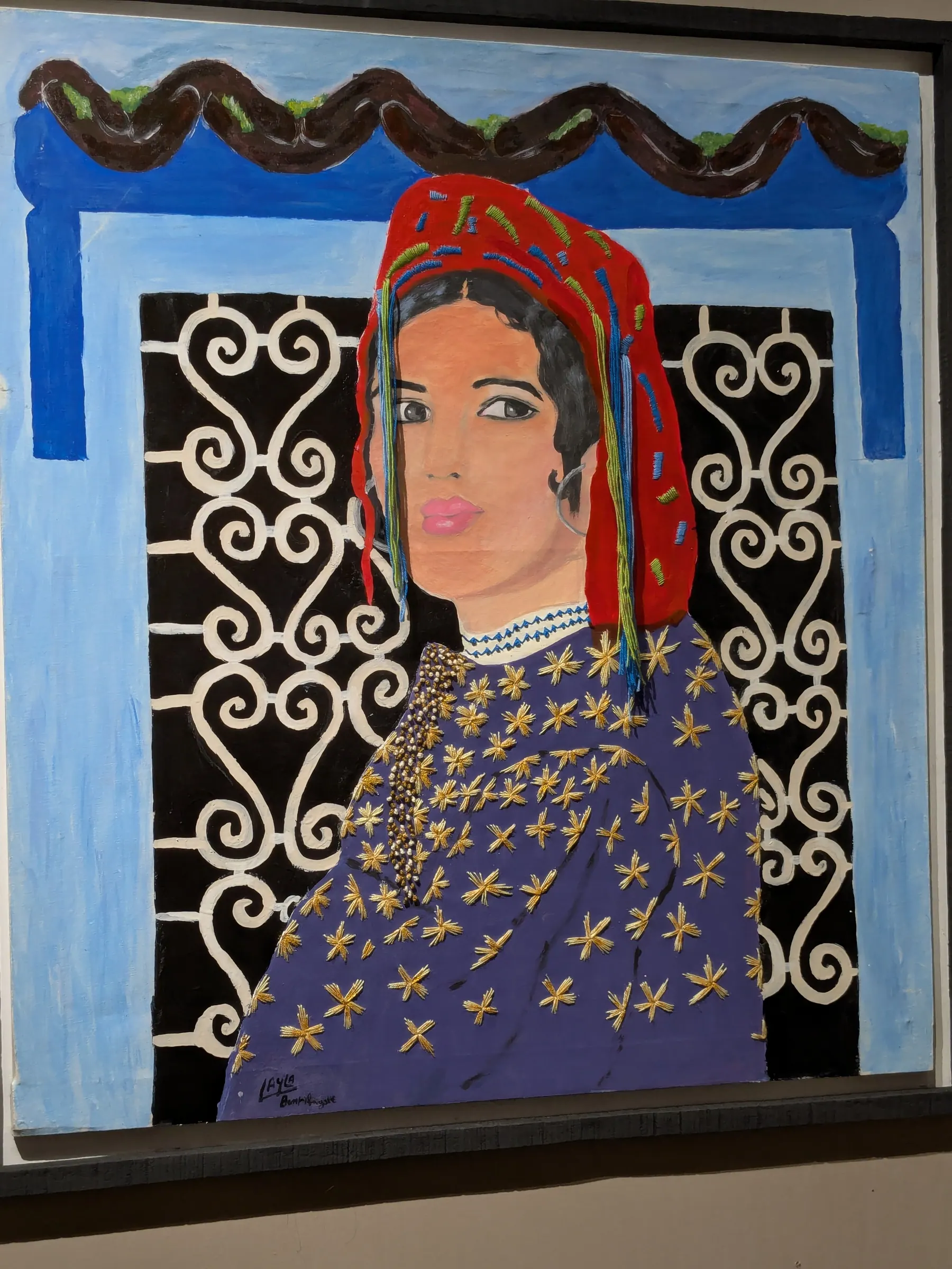A colourful painted portrait displayed in Essaouira