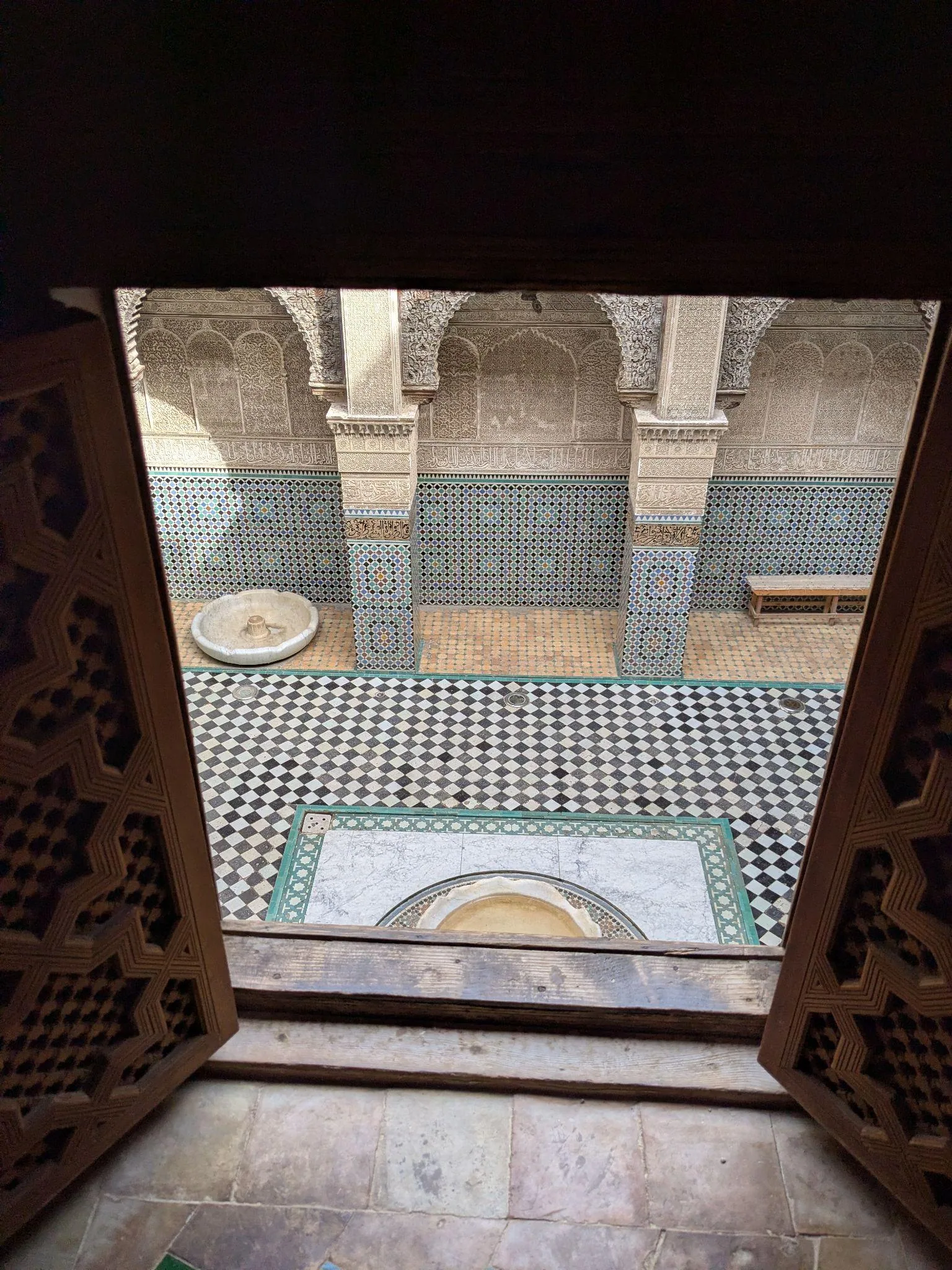 Detailed zellige tilework inside Al Attarine Madrasa in Fez
