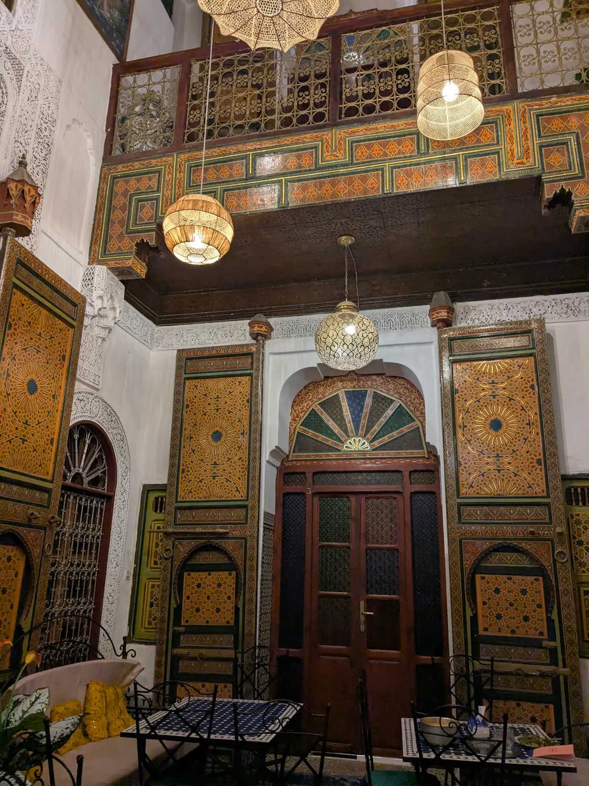 The ornate interior courtyard of Riad Fes Zayna in Fez