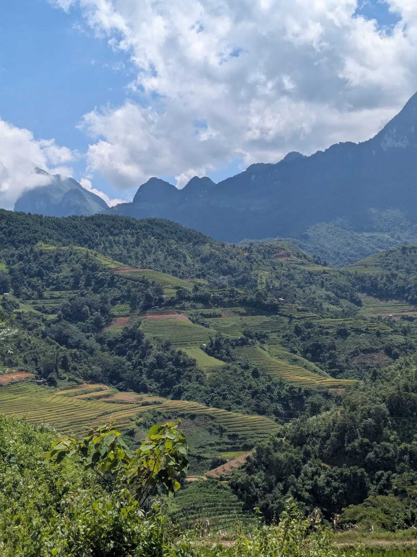 Terraced fields, scattered houses and dark mountain ridges in the La Si area