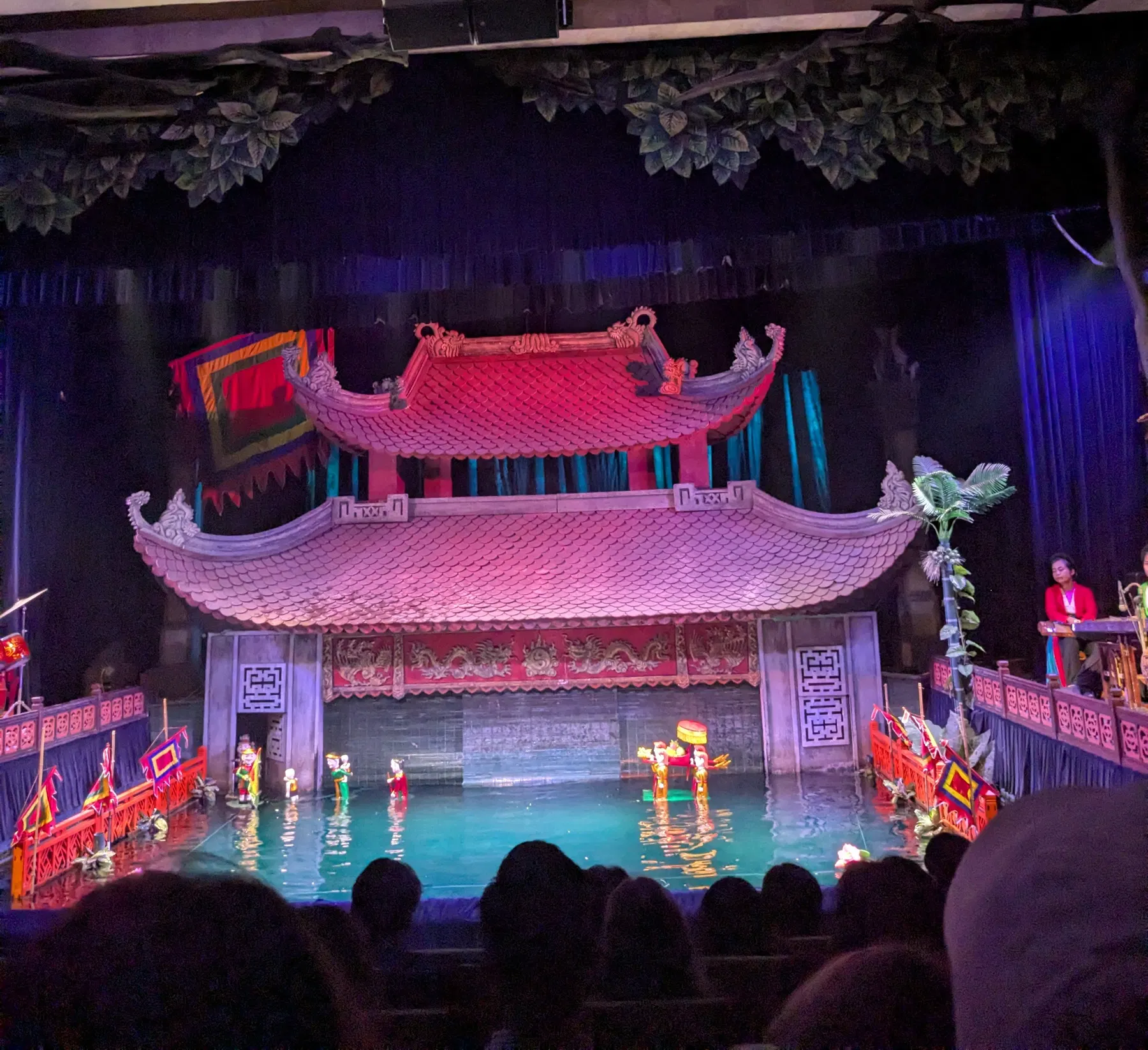 A colourful water-puppet performance on a pool stage in Hanoi