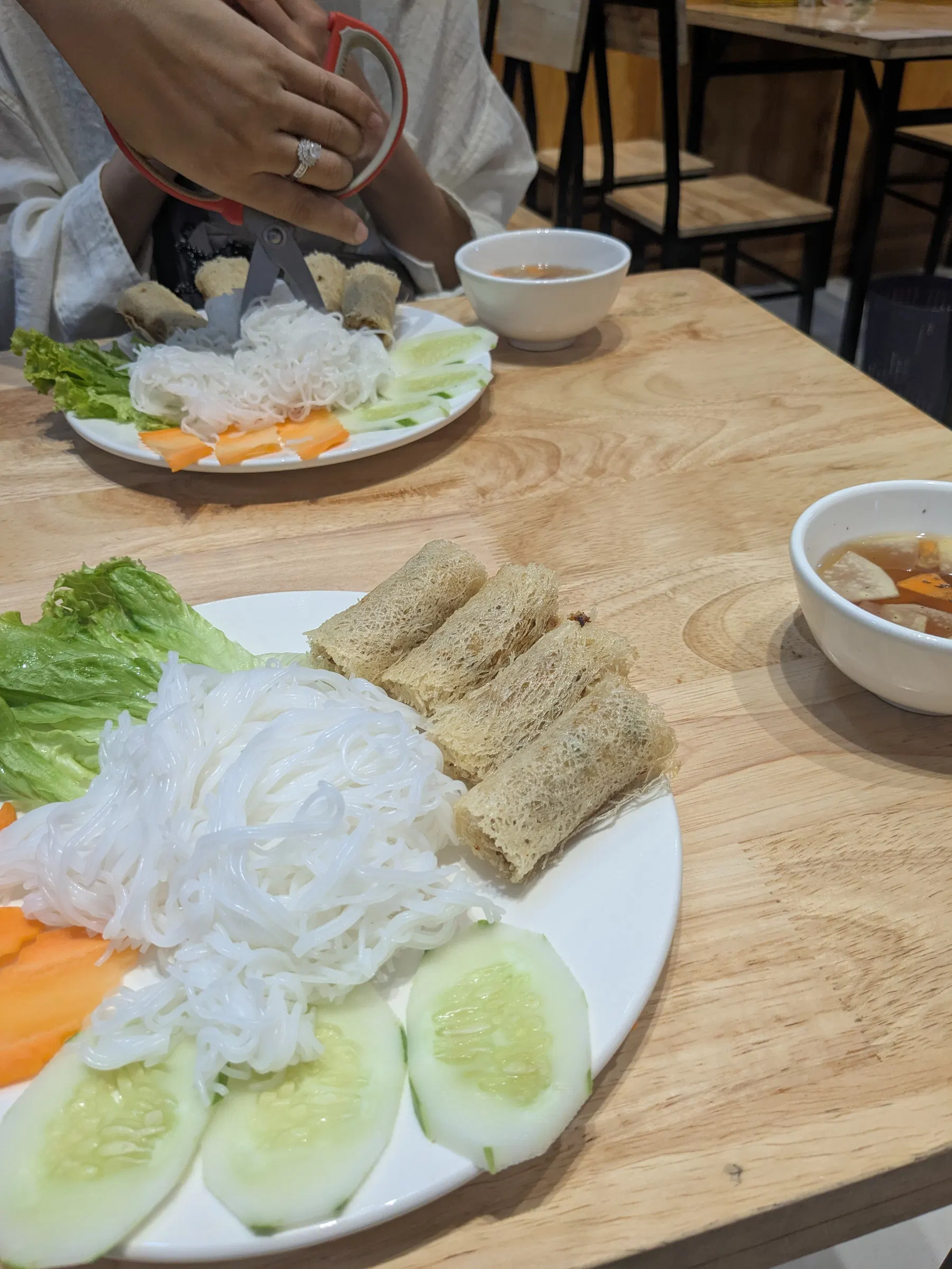 Fresh rice-paper rolls and herbs served at a Hanoi restaurant