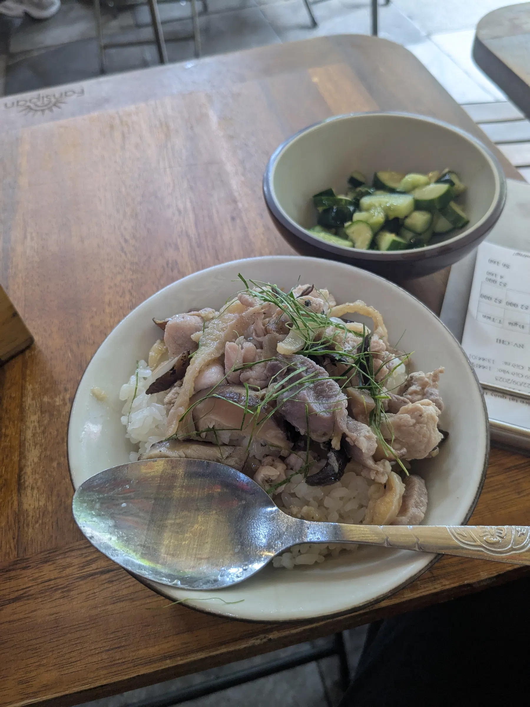 A bowl of Vietnamese noodles with meat and herbs in Hanoi