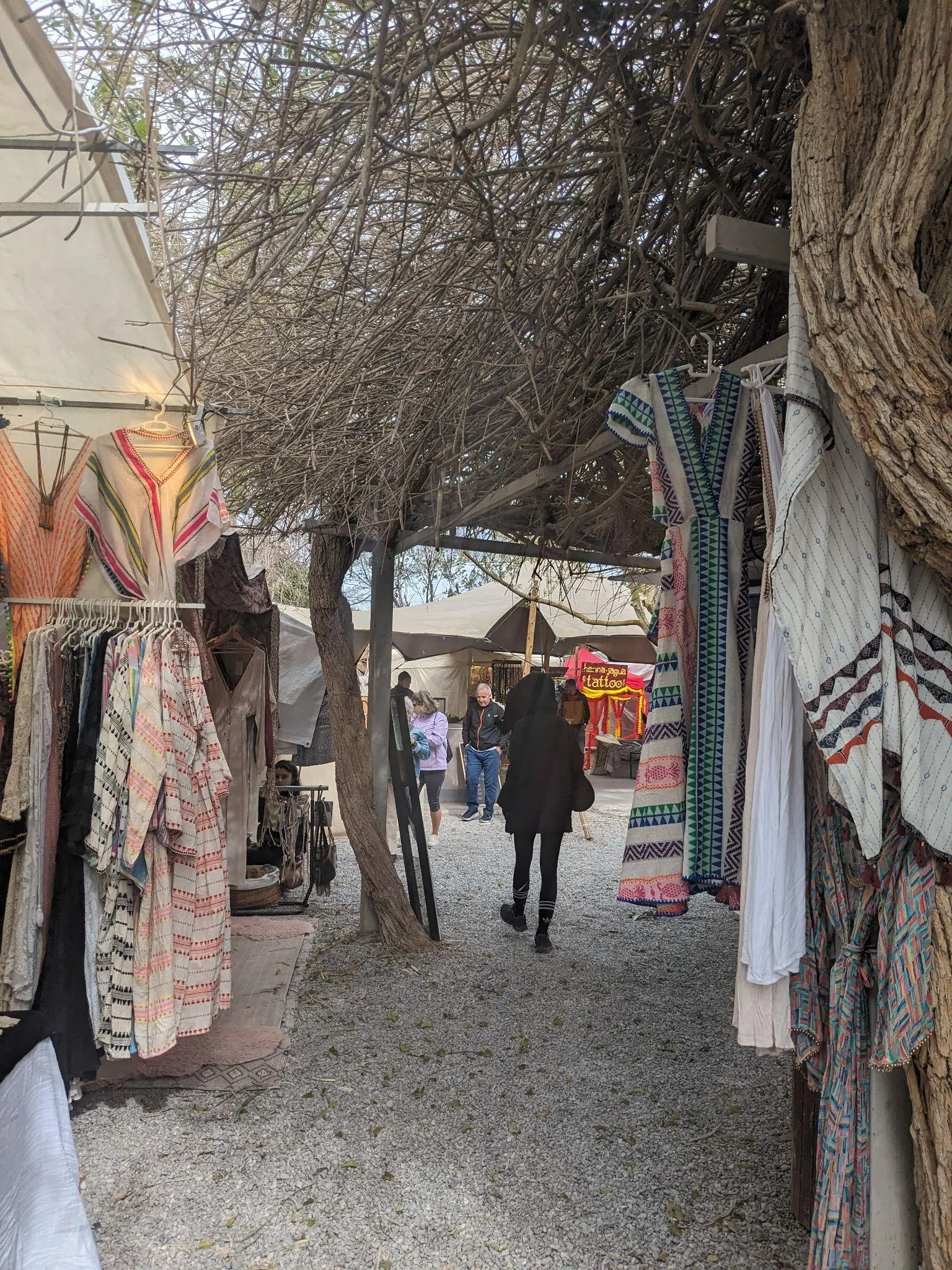 Colourful bohemian clothing and artisan jewelry displayed at Las Dalias Hippie Market