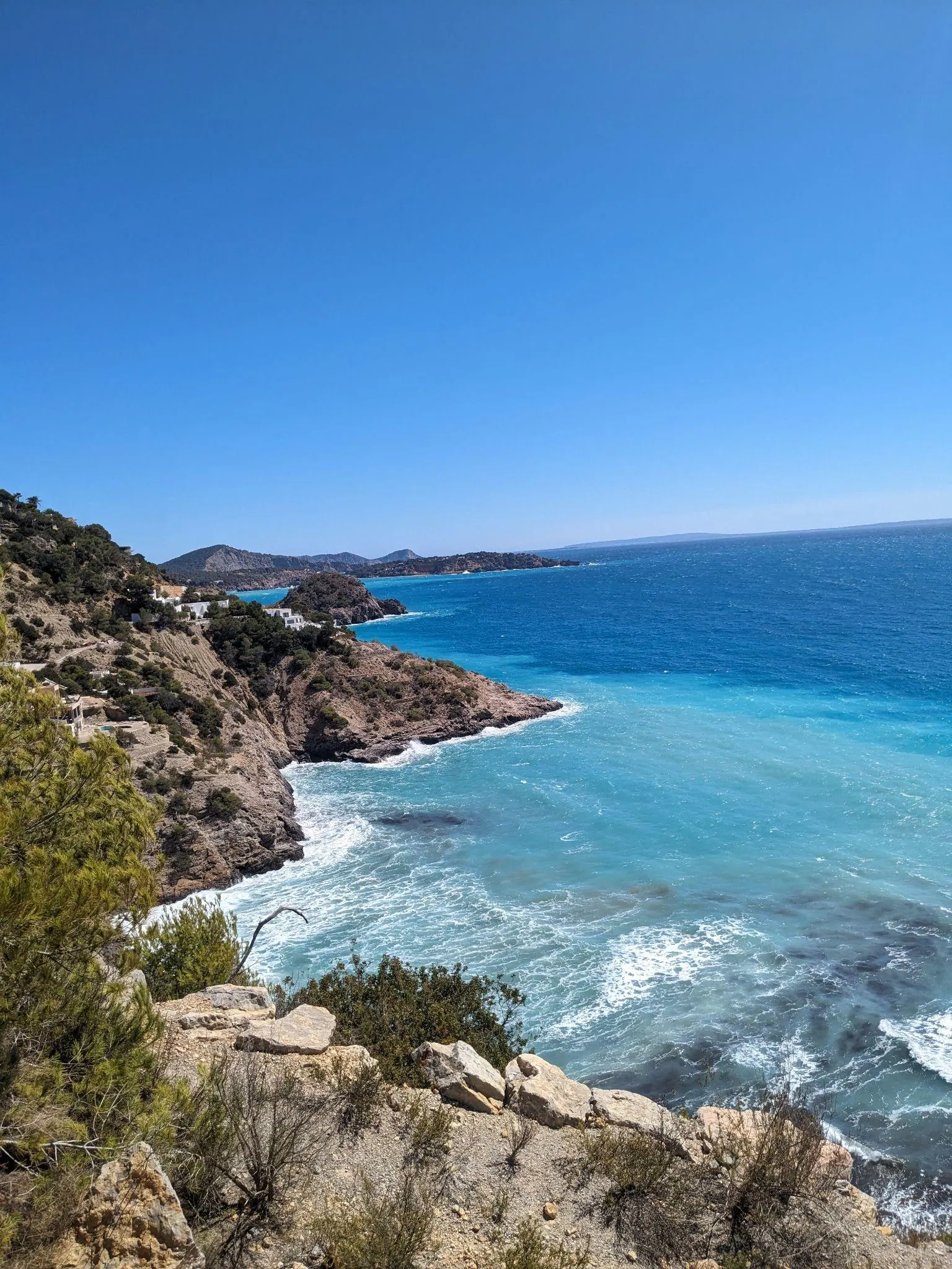 Clifftop views overlooking rocky headlands and turquoise water near Es Cubells