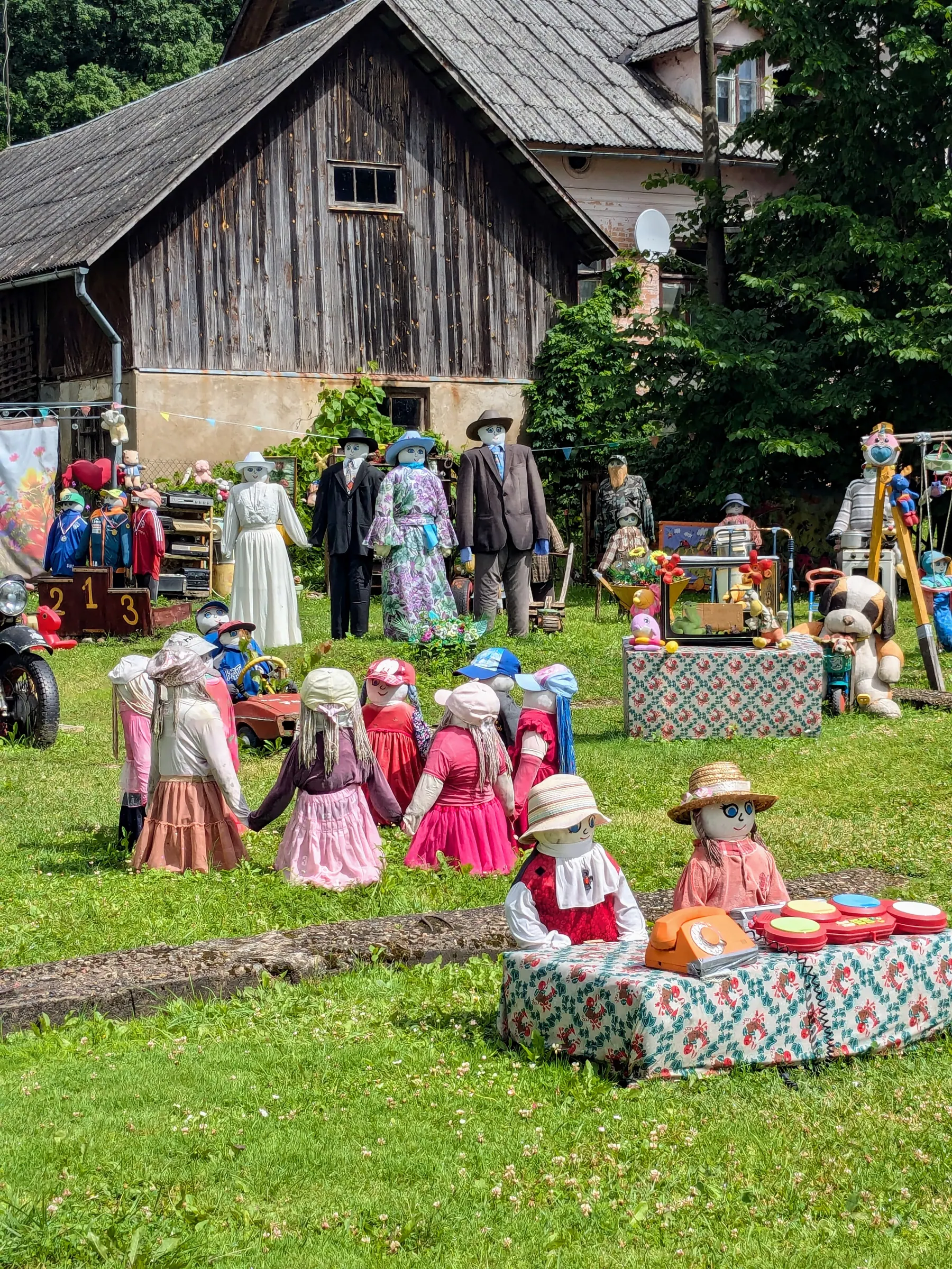 The handmade dolls of Sabile Doll Garden arranged in everyday scenes