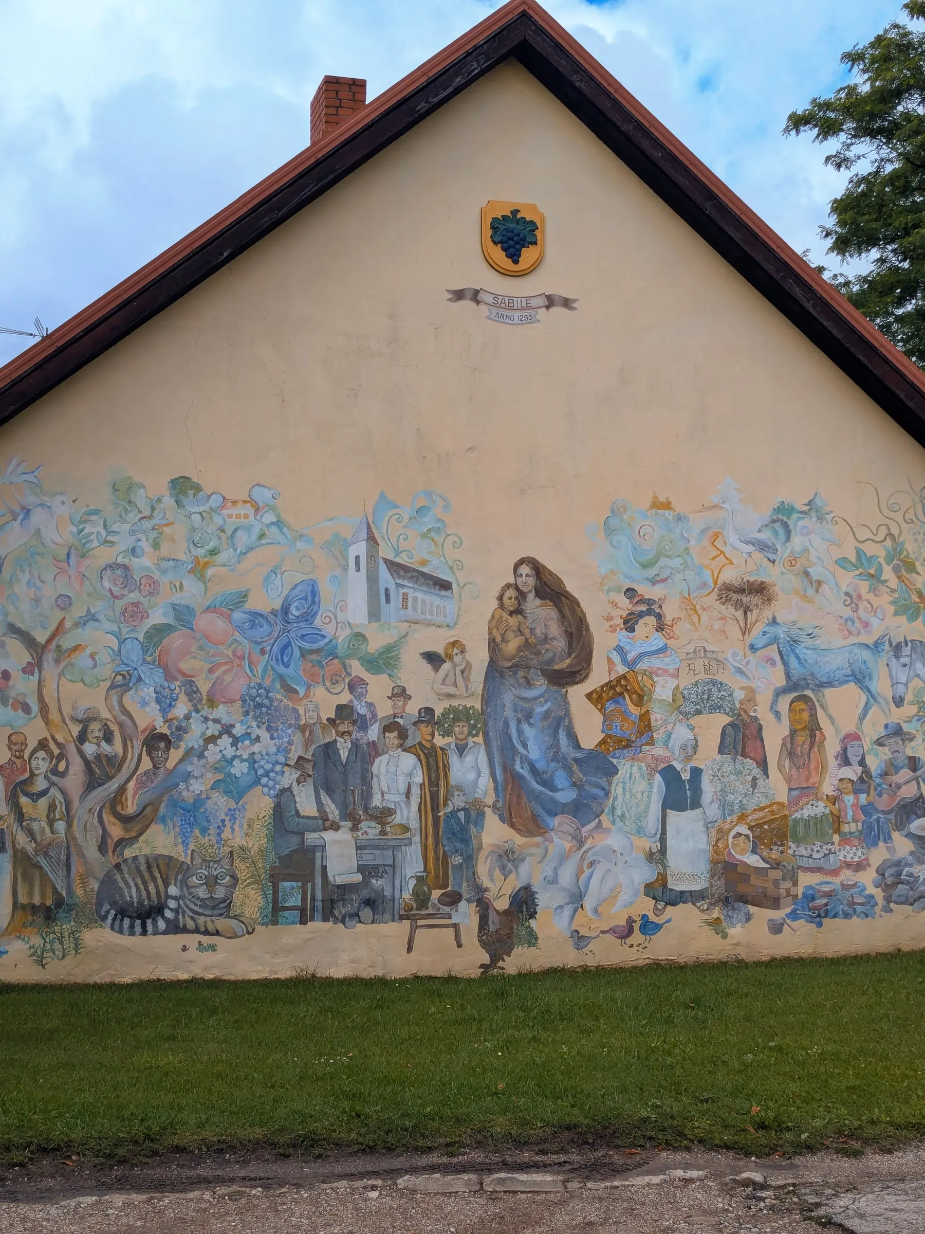 A large mural illustrating the people, landscape and history of Sabile