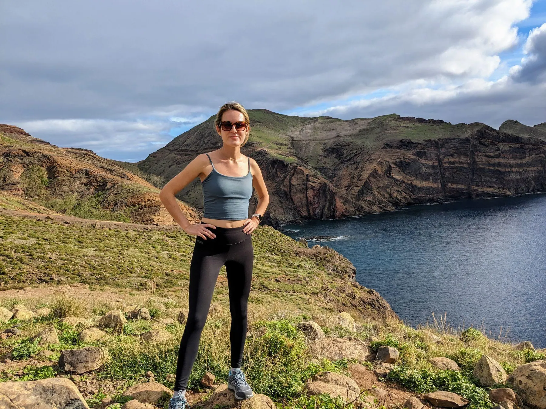 A traveler standing on the rocky coastline of Ponta de São Lourenço in Madeira