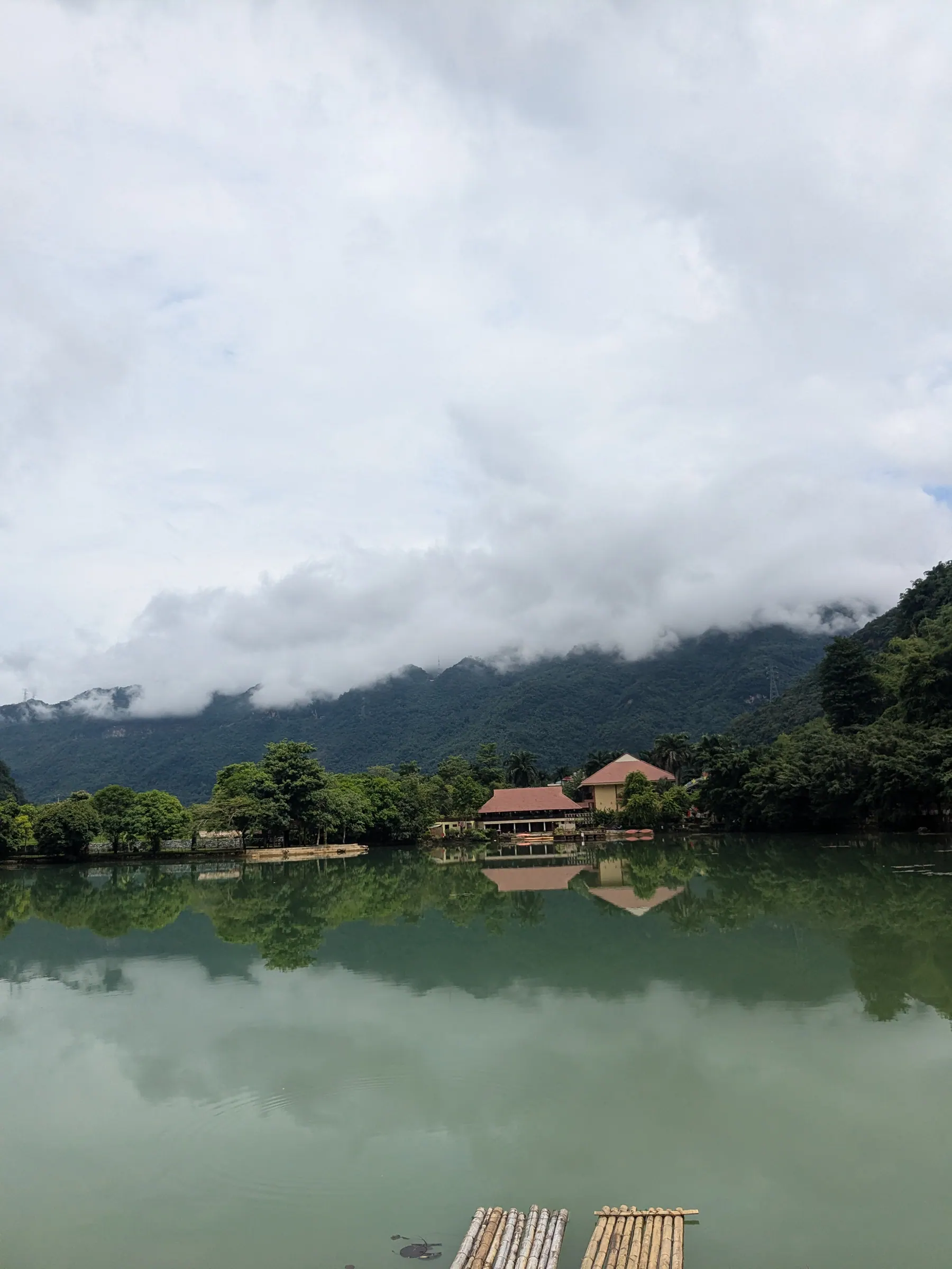 Mist over Mo Luong lake and the mountains near Lac Village