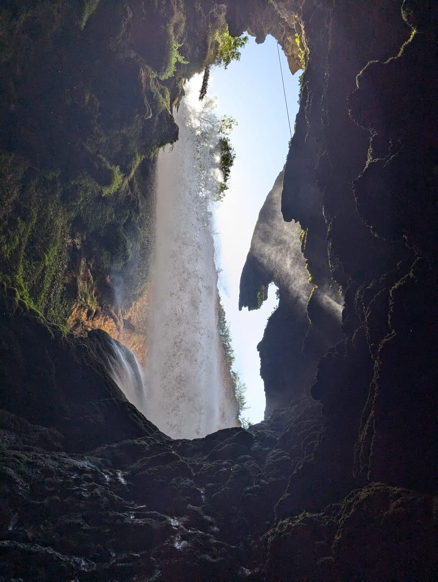 A waterfall seen from inside a cave at Monasterio de Piedra