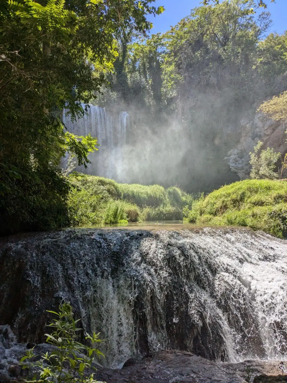 Waterfall spray over green terraces in Monasterio de Piedra