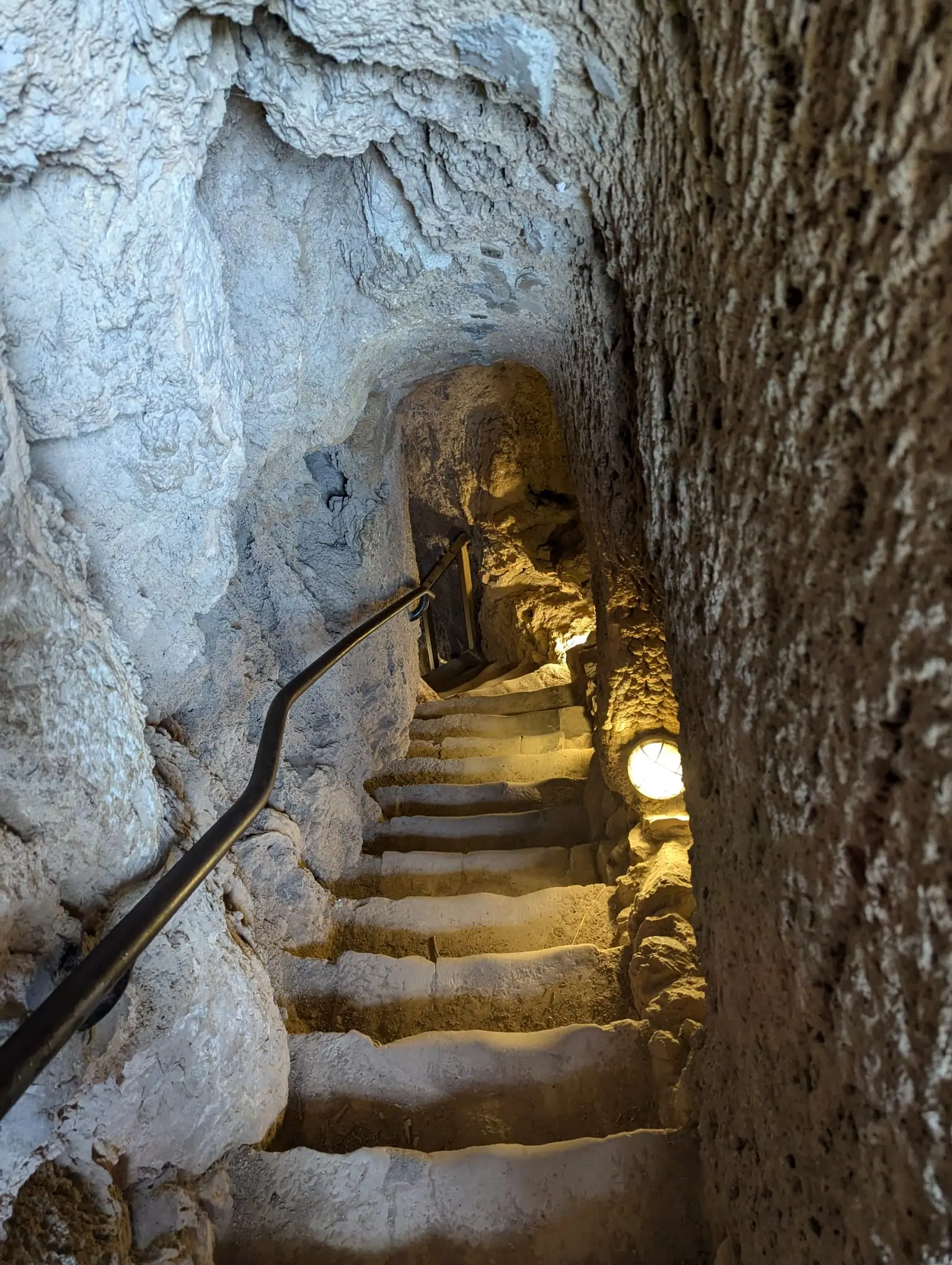 Stone stairs descending into the Iris Grotto at Monasterio de Piedra