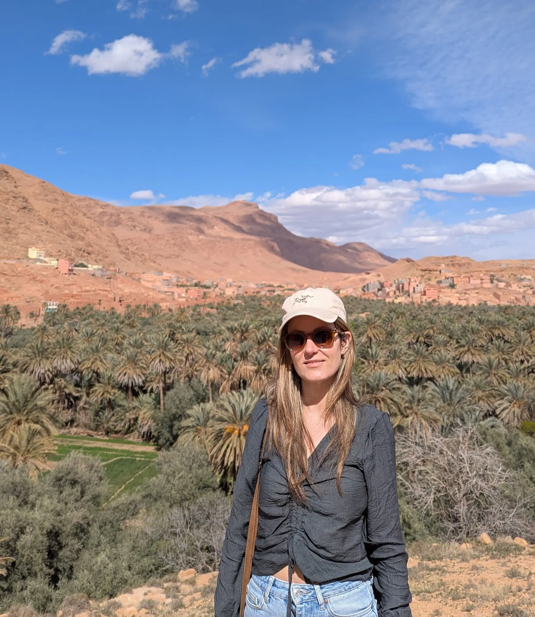 A traveler standing in a desert valley in Morocco
