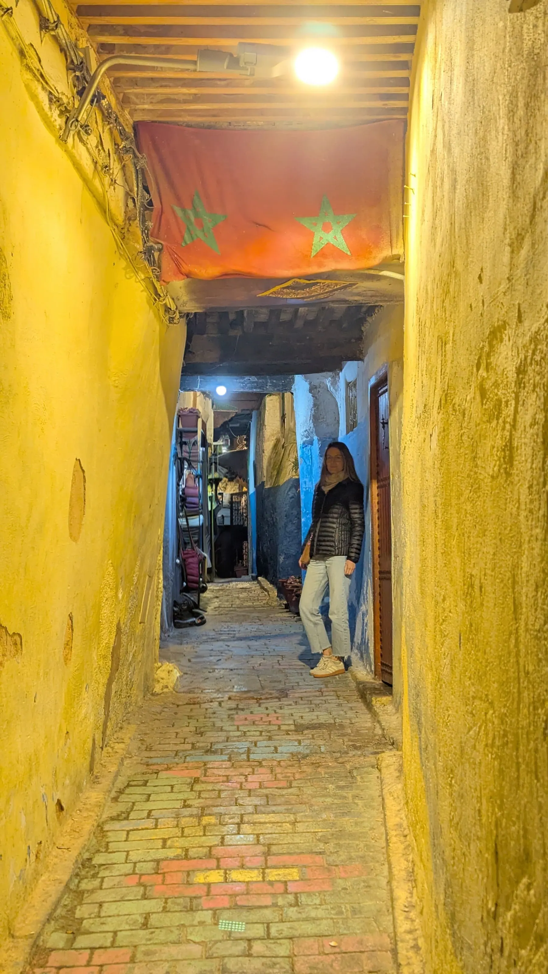 A Moroccan flag painted inside a narrow building entrance