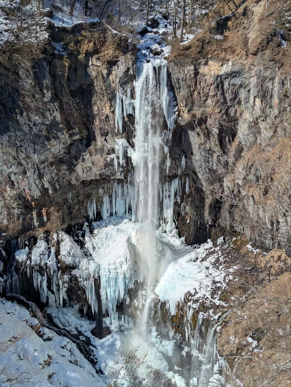 Kegon Falls plunging through winter cliffs in Nikko