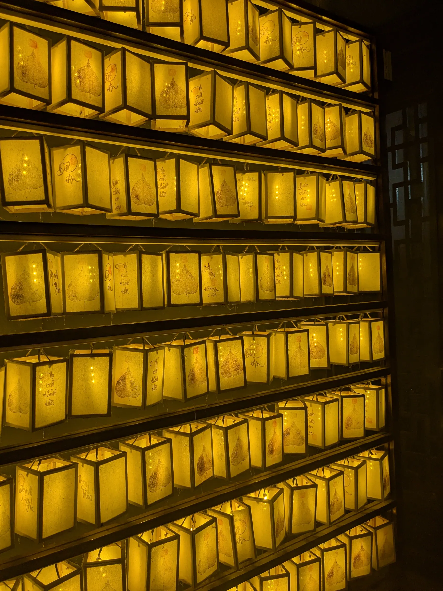 An illuminated pagoda framed by lanterns in Ninh Binh old town