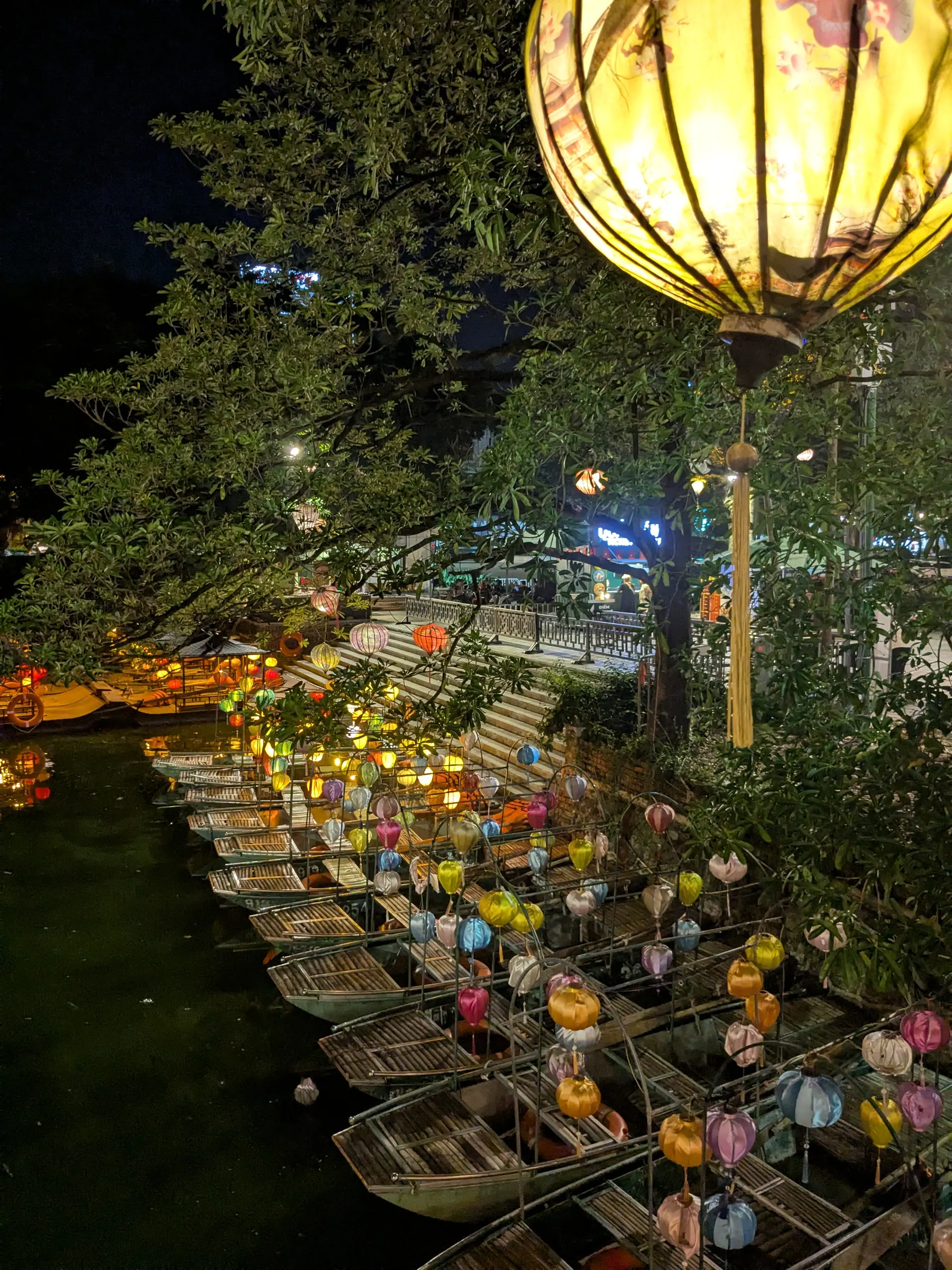 A lantern-lit walkway and temple building in Ninh Binh old town