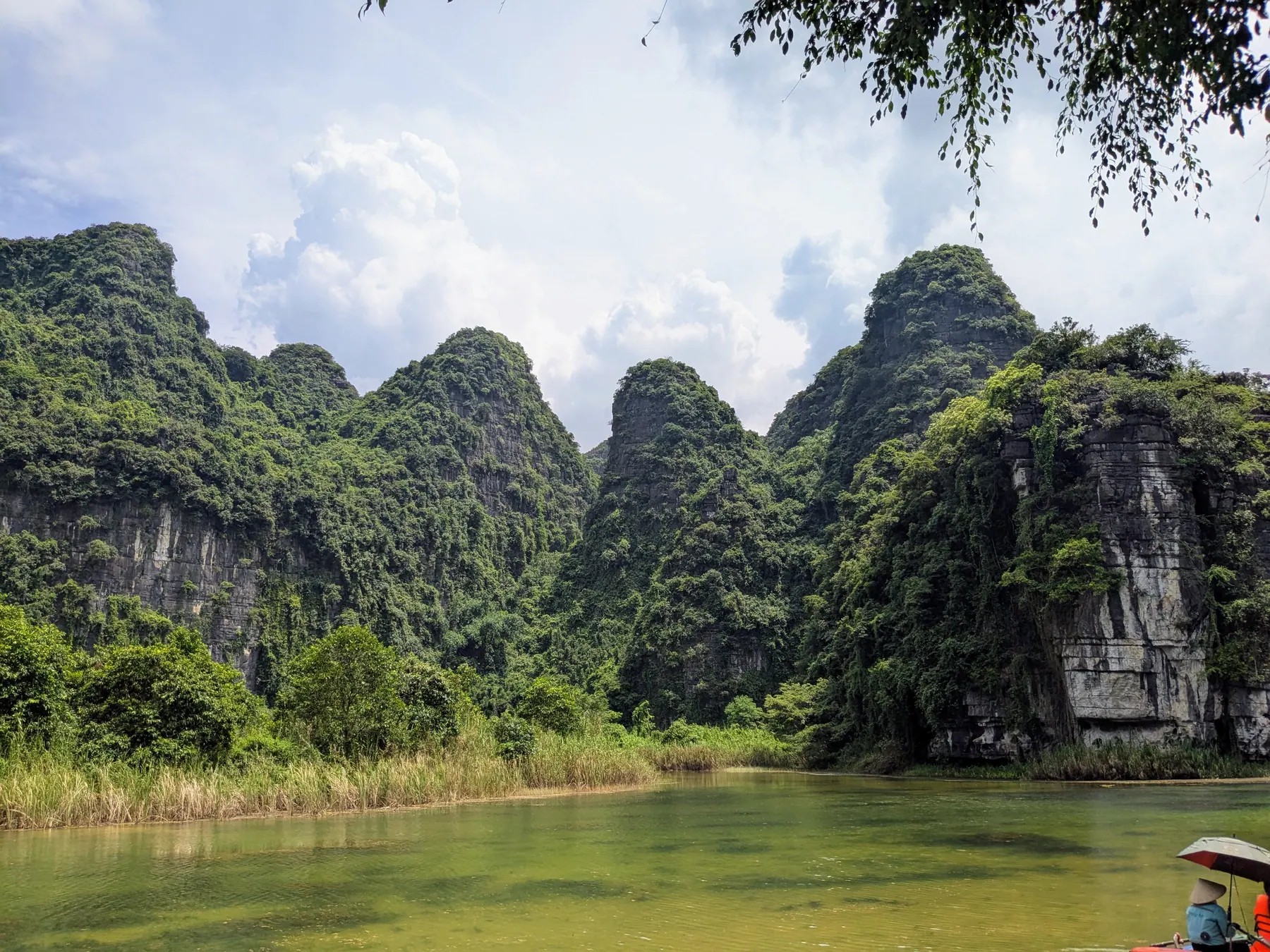Karst peaks rising above the water at Trang An in Ninh Binh, Vietnam