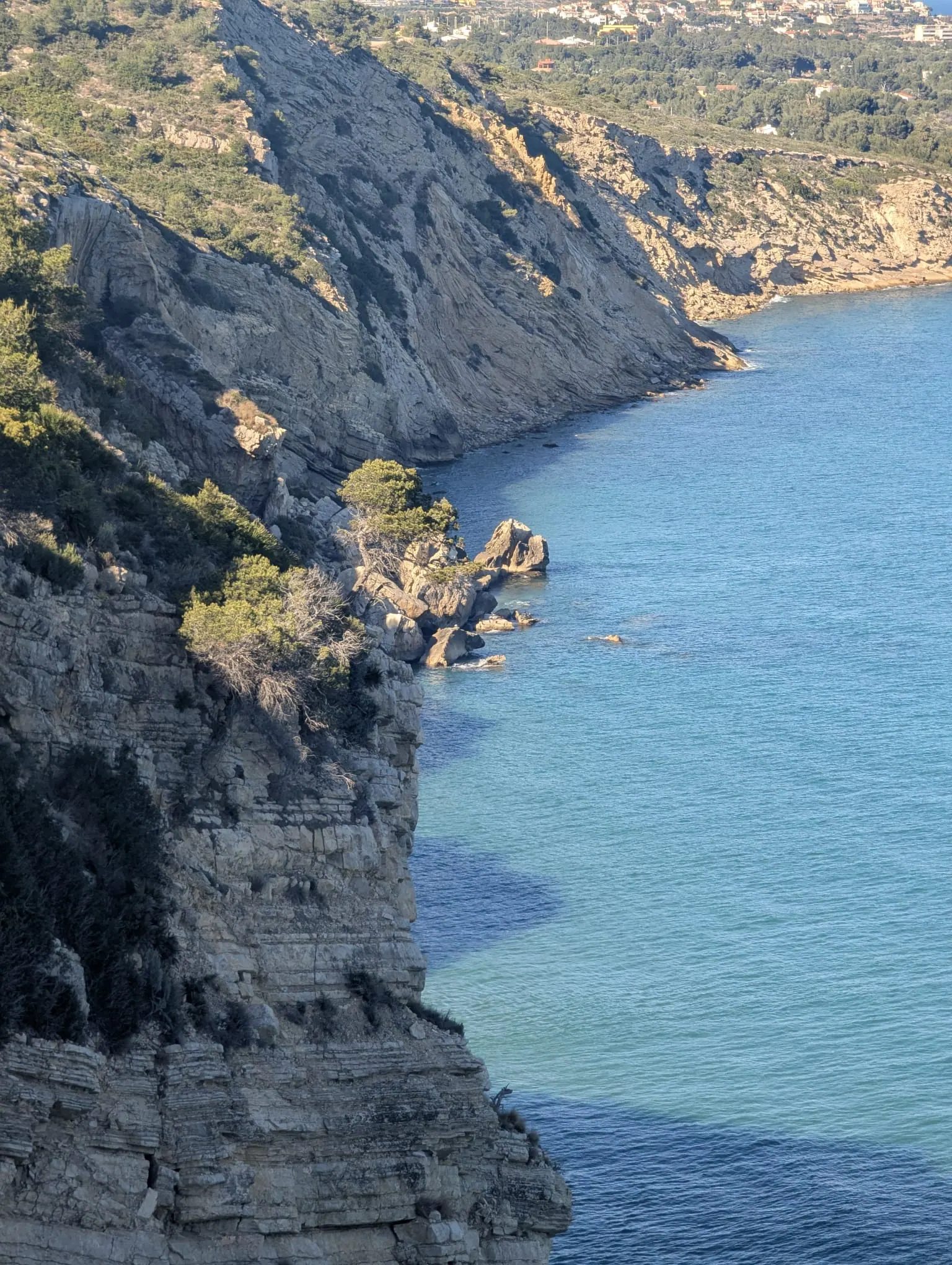 Rocky cliffs and clear blue water on the Sierra de Irta coast