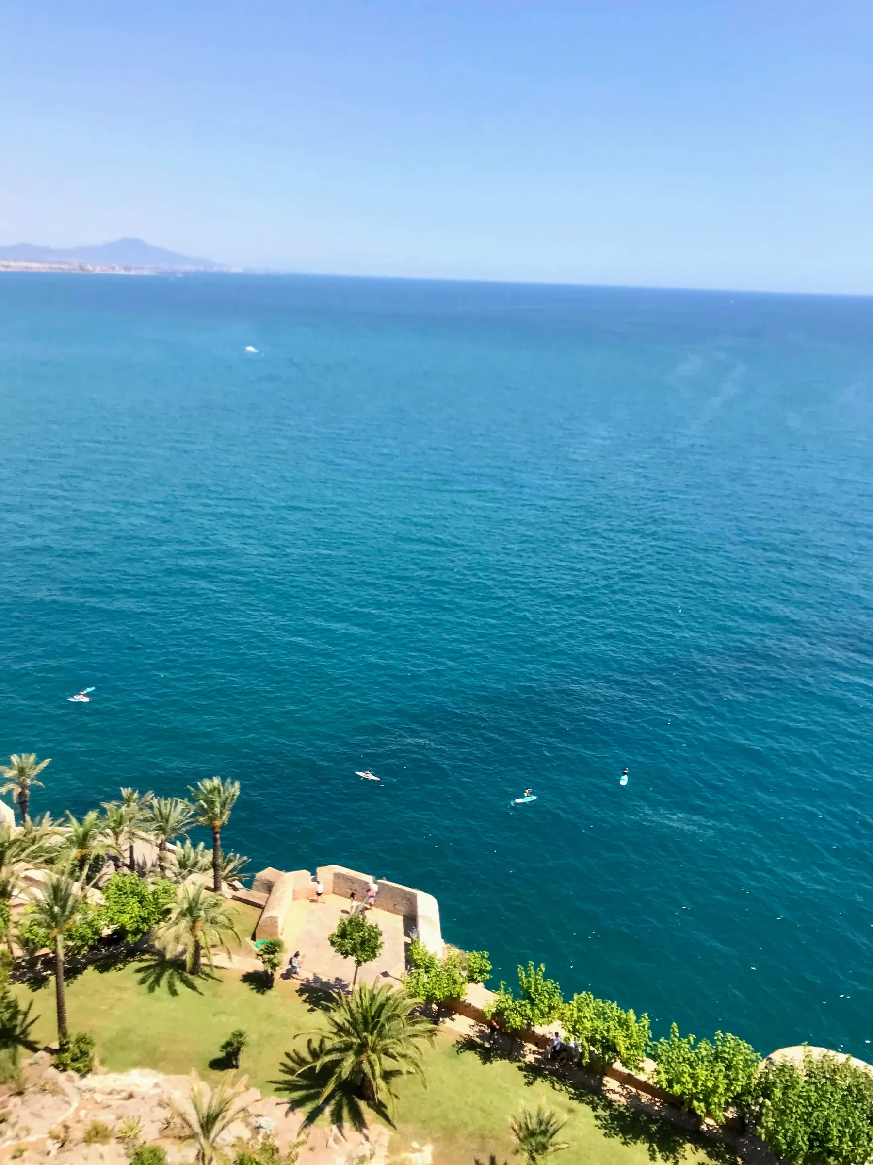 Turquoise Mediterranean Sea and castle gardens seen from Peñíscola Castle