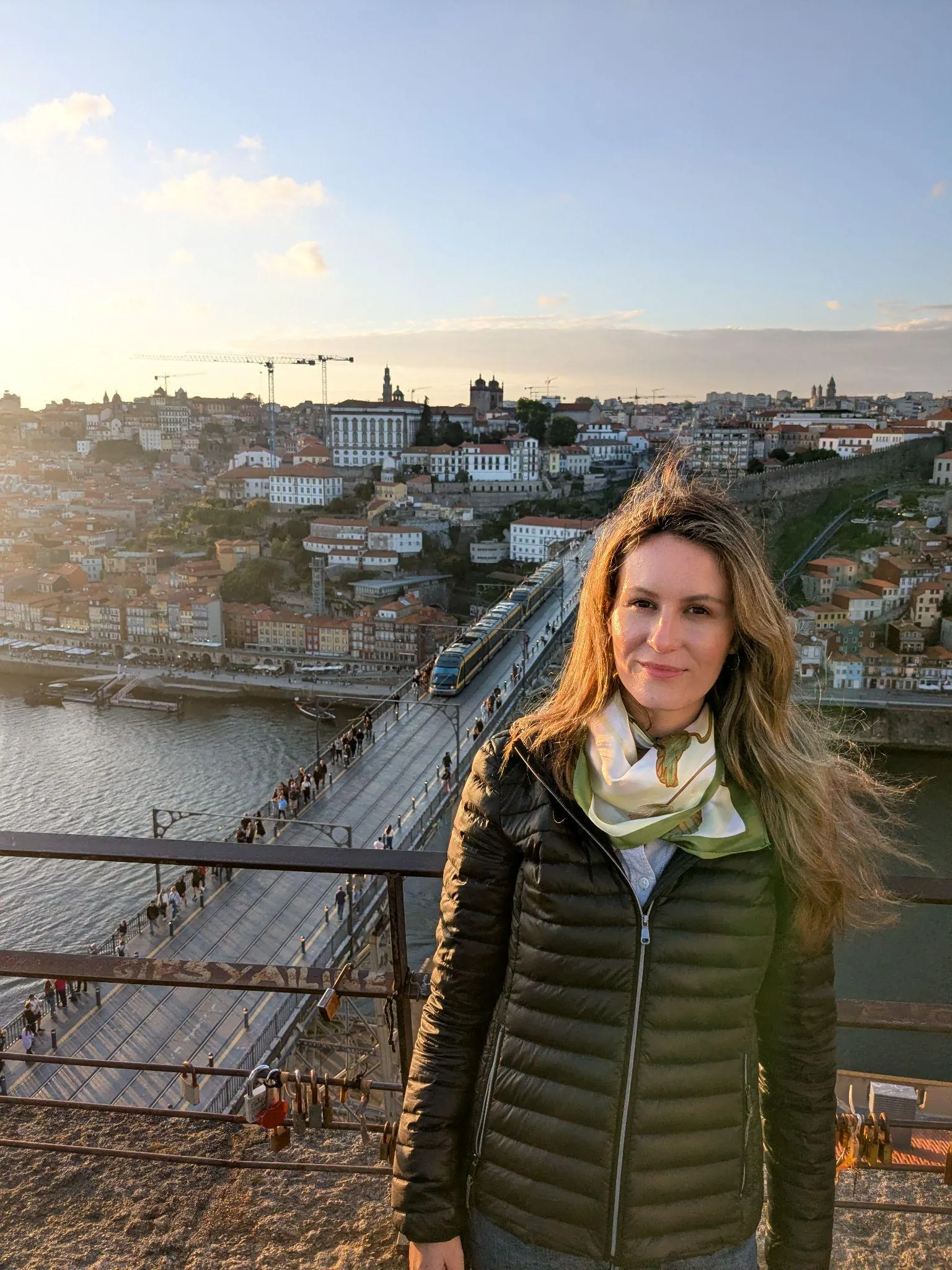 A traveler at a Gaia viewpoint with Porto behind her