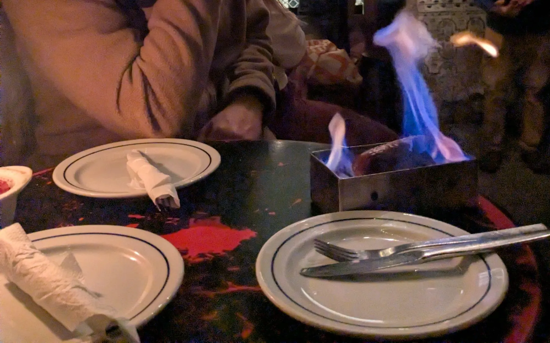 A flaming sausage dish served at Museu d'Avo in Porto