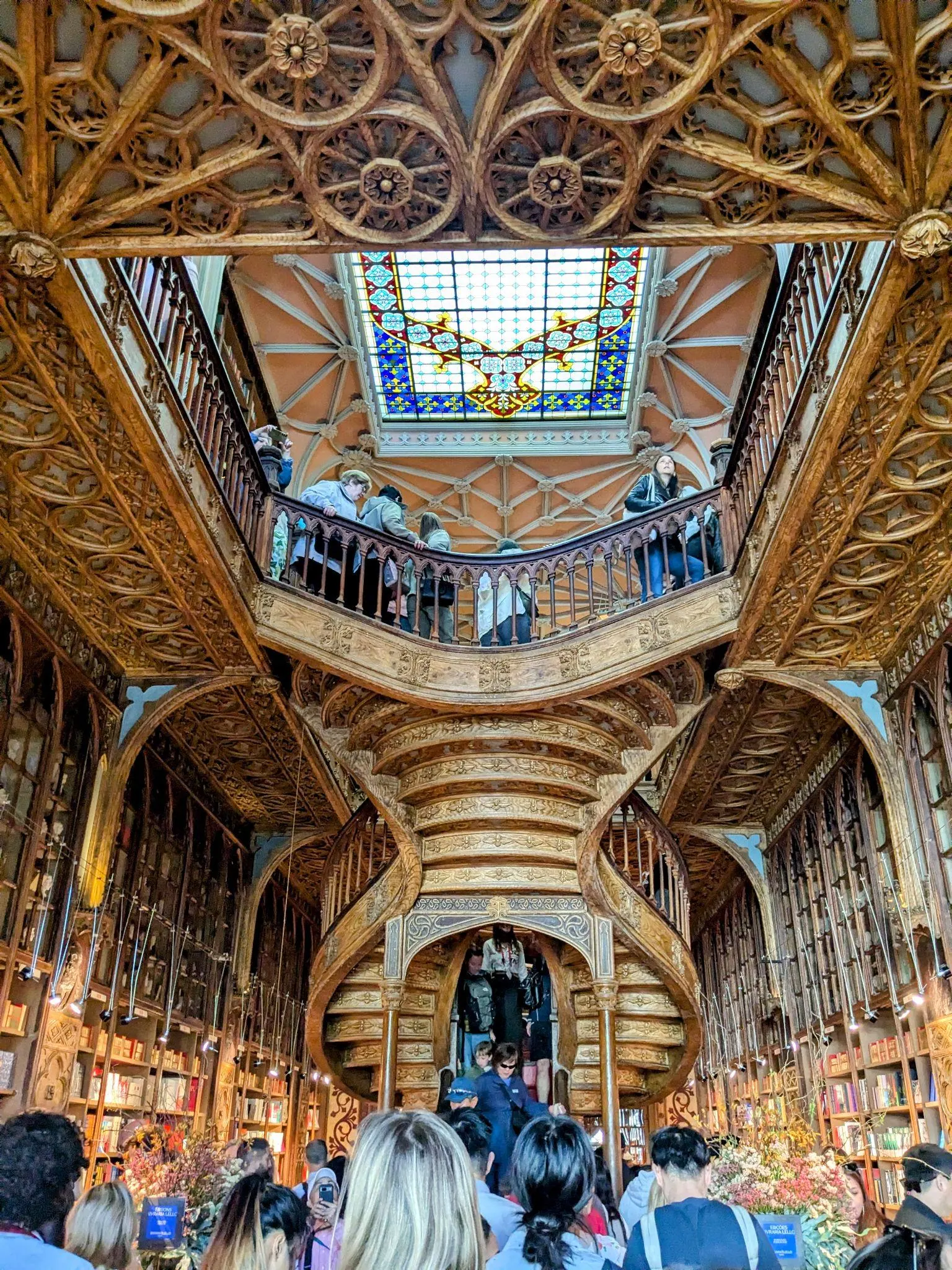 The famous ornate staircase inside Livraria Lello in Porto