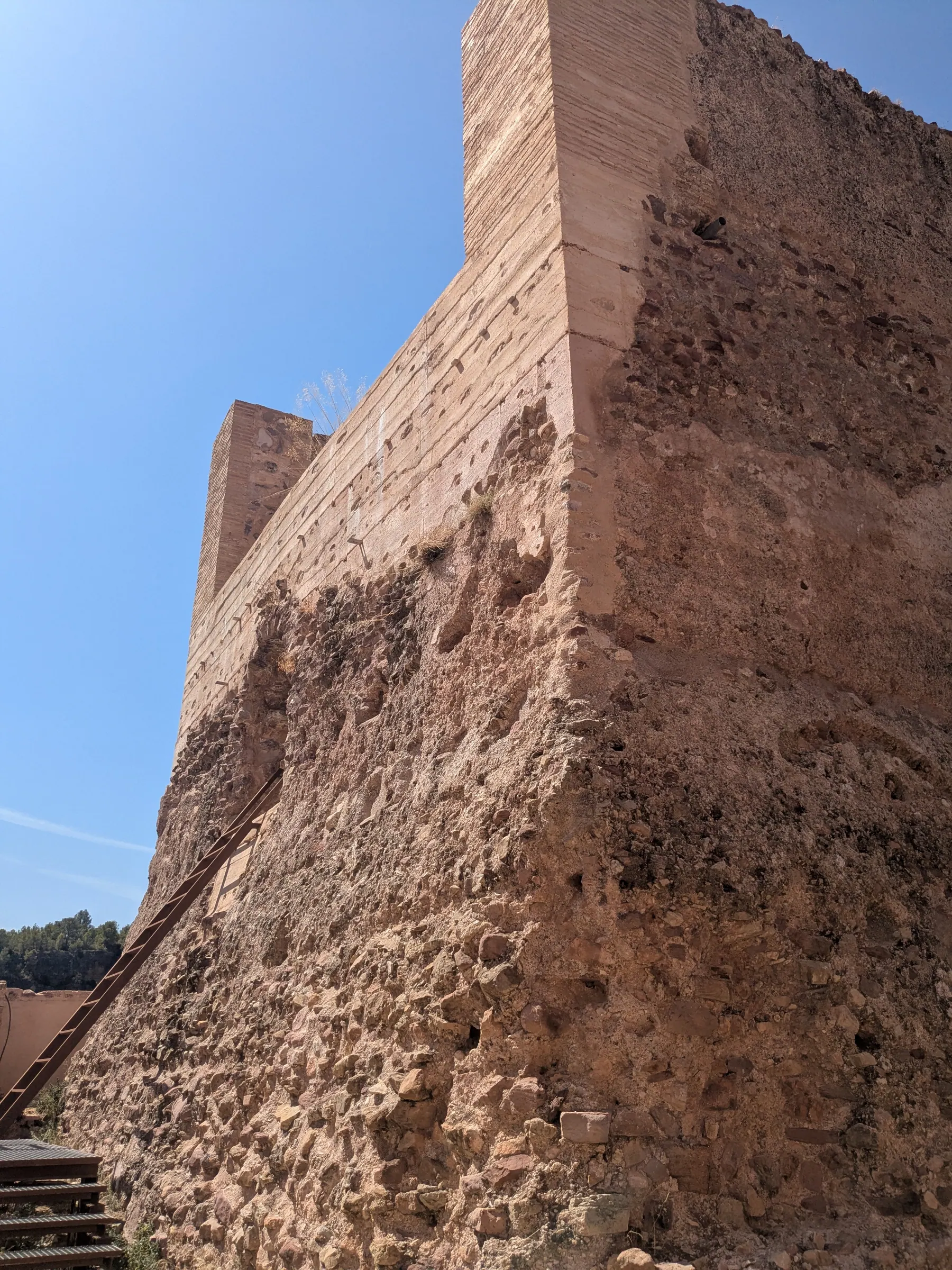 The stone walls of the Torre de Pardines in Olocau