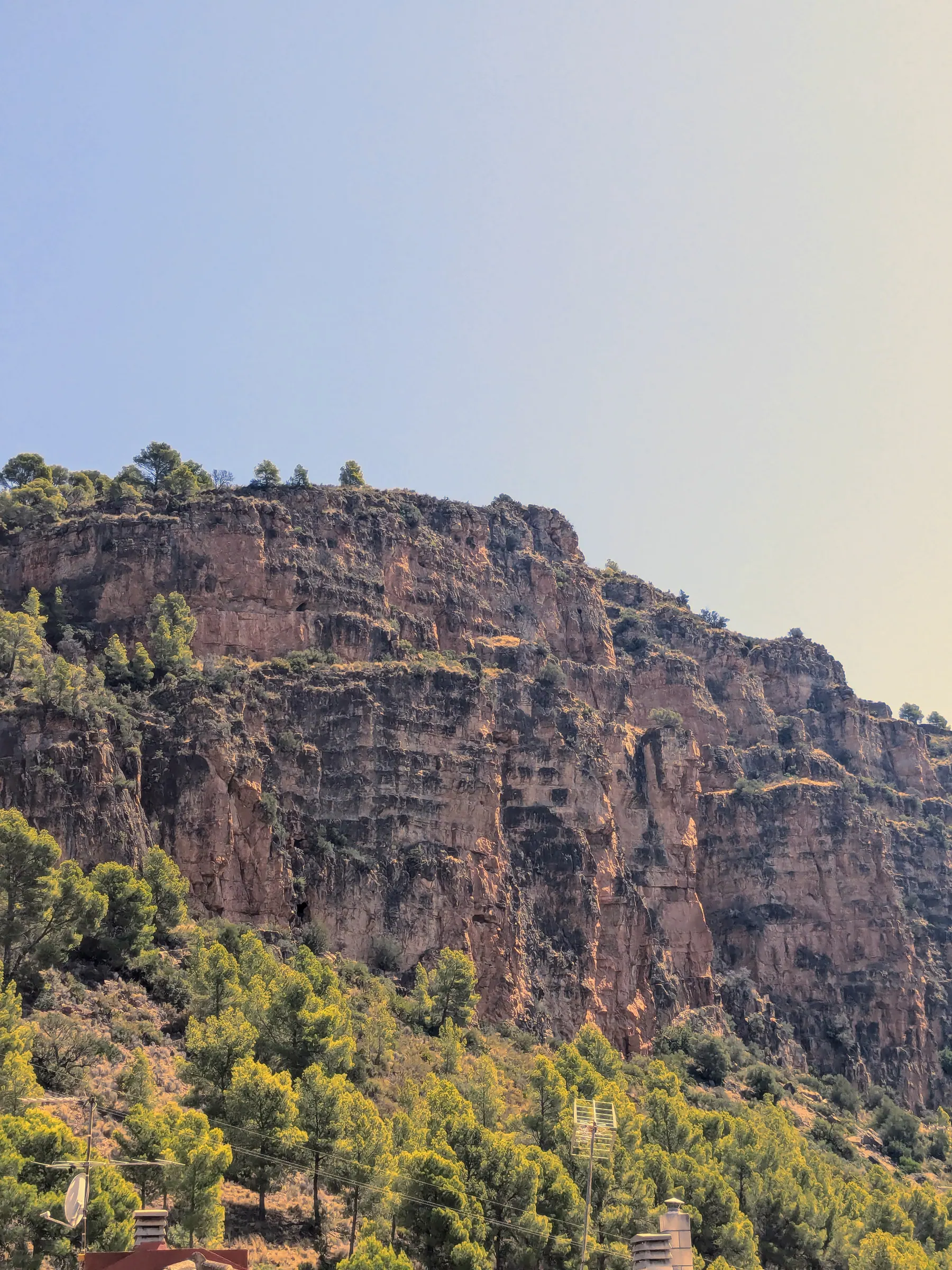 Castell del Real rising above the hills near Olocau