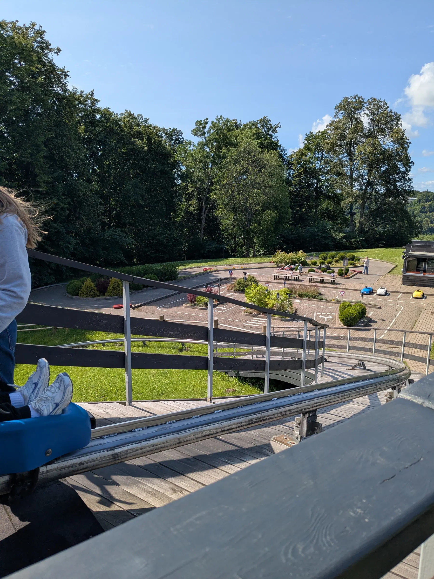 The toboggan run descending through the trees at Tarzāns adventure park