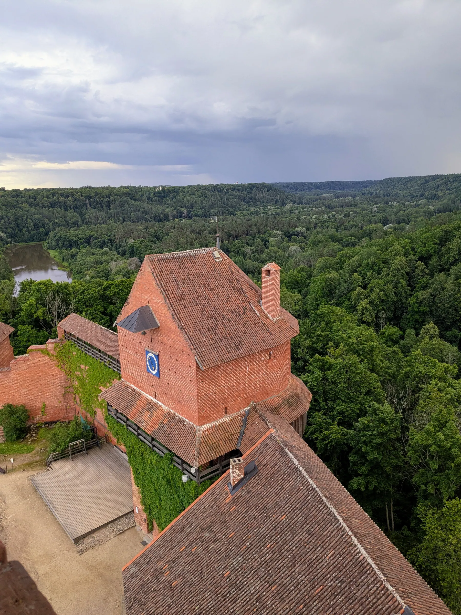 A red brick tower and courtyard at Turaida Castle