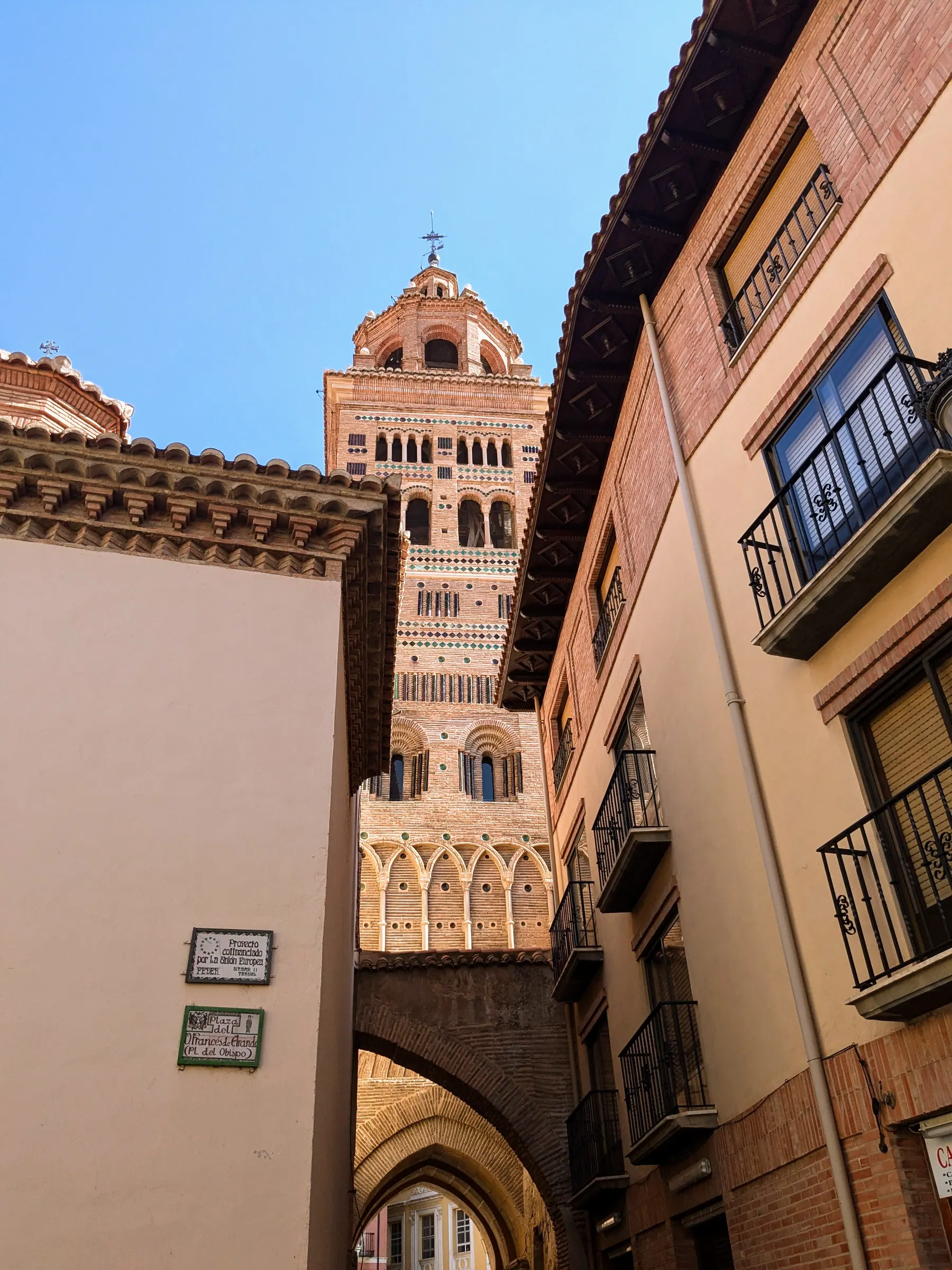 Teruel Cathedral's Mudéjar tower framed by old-town buildings