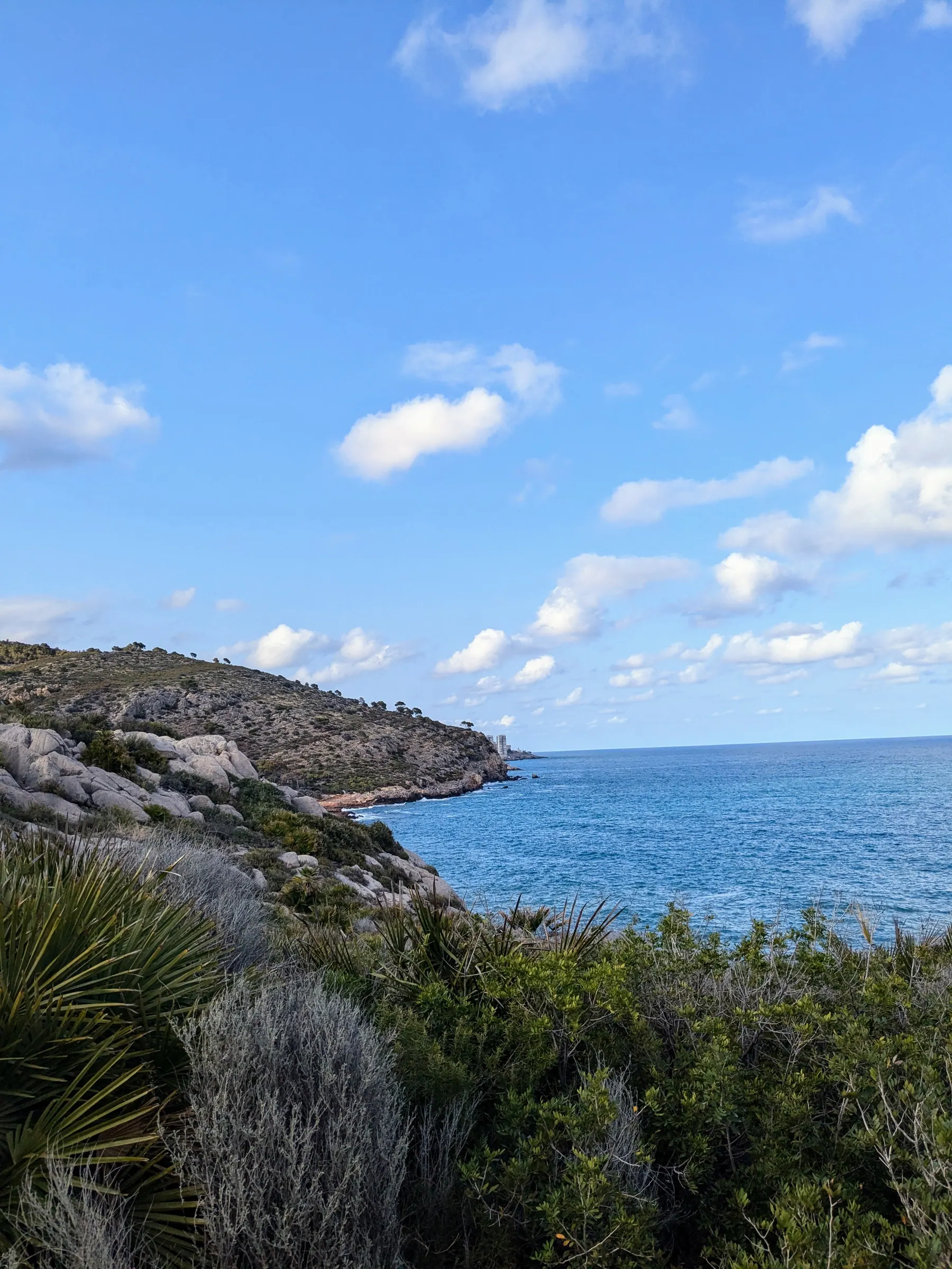 Rocky coastline and blue Mediterranean sea beside the Via Verde del Mar